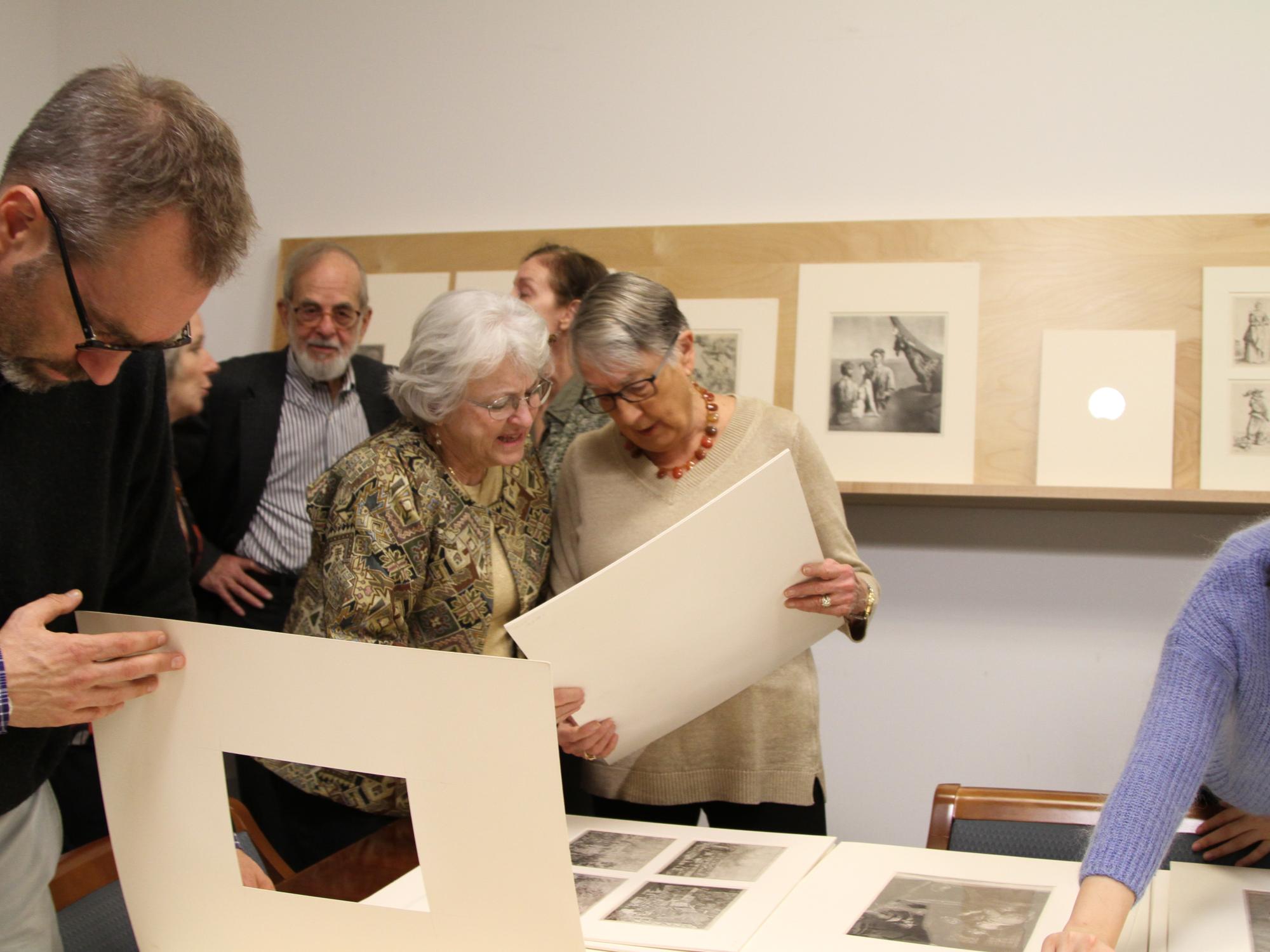 Carol Goodfriend examining a print