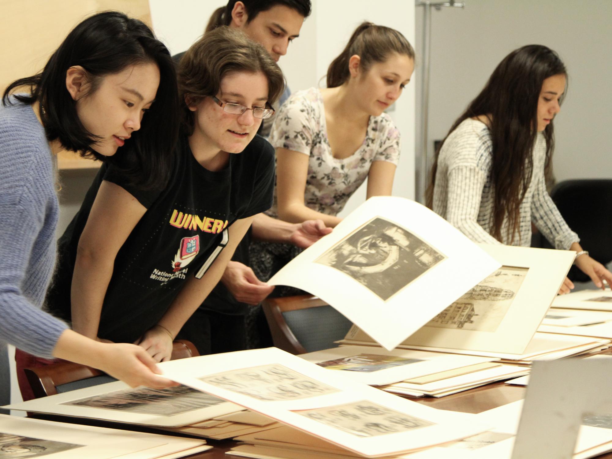 student looking at prints