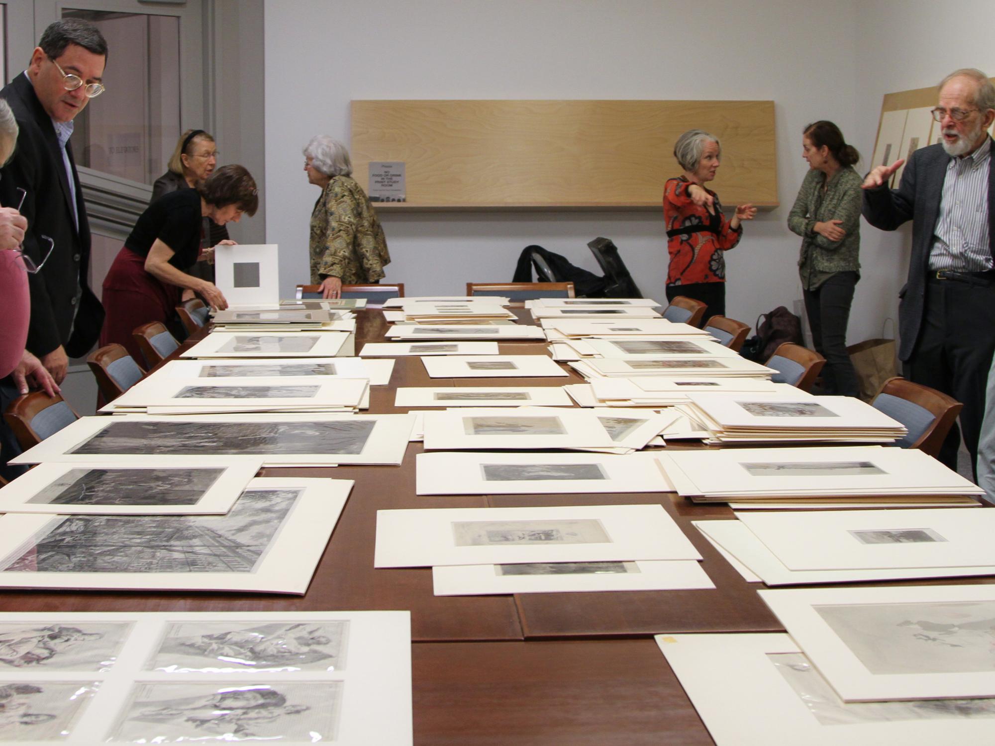 A view of the drawings and prints spread out on the table 
