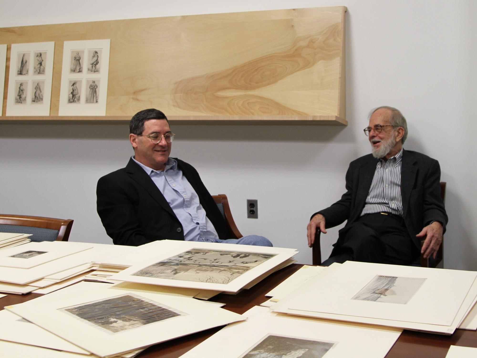 Patrick McGrady and Jim Goodfriend discussing the drawings and prints