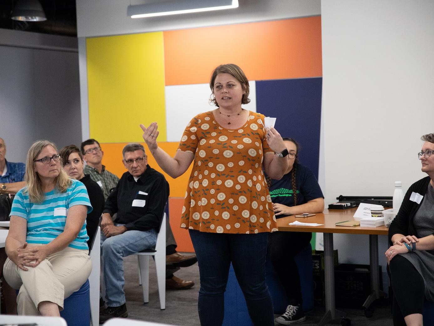 Woman speaks to group at reNew Kensington Community Workshop