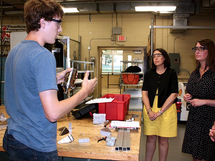 Lunar Lion shows rocket engine to DCED representatives