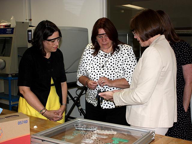 DCED representatives look at 3D printed parts