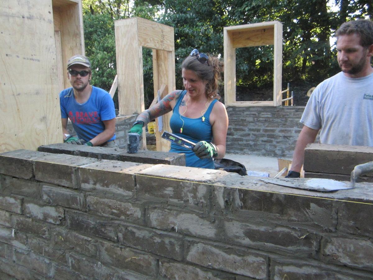 Workshop participants making sure that their wall is level