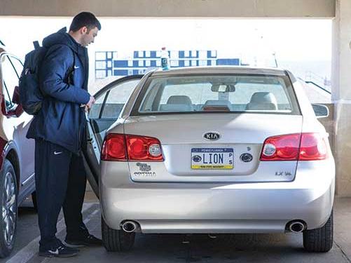 Zach Sowa gets into his car to drive to a mascot appearance at the HUB.