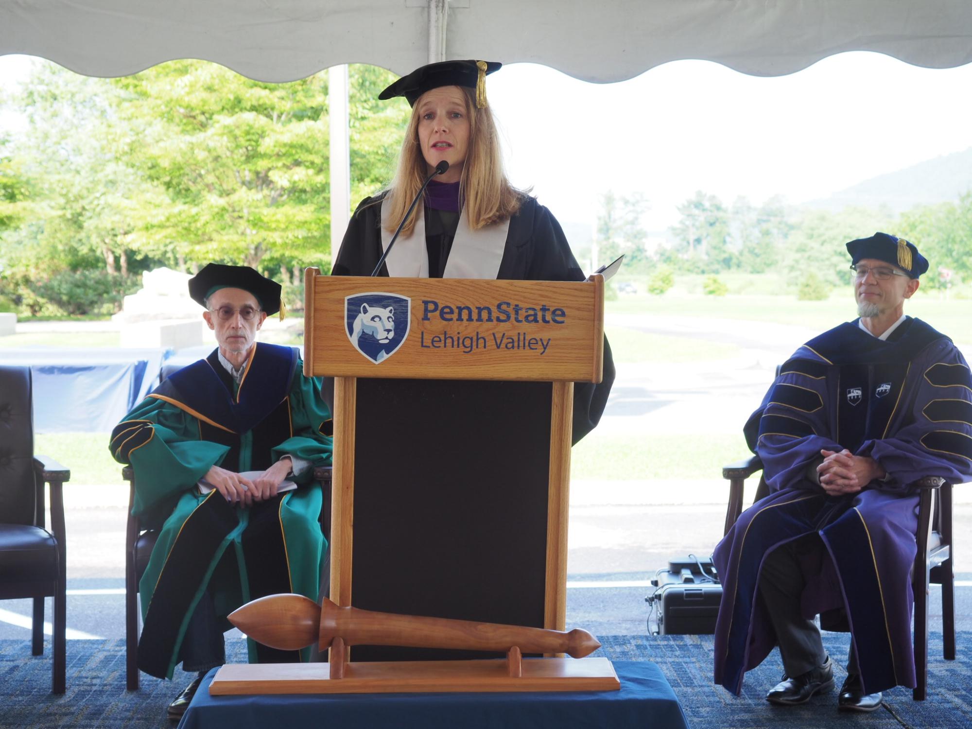 woman speaking at podium