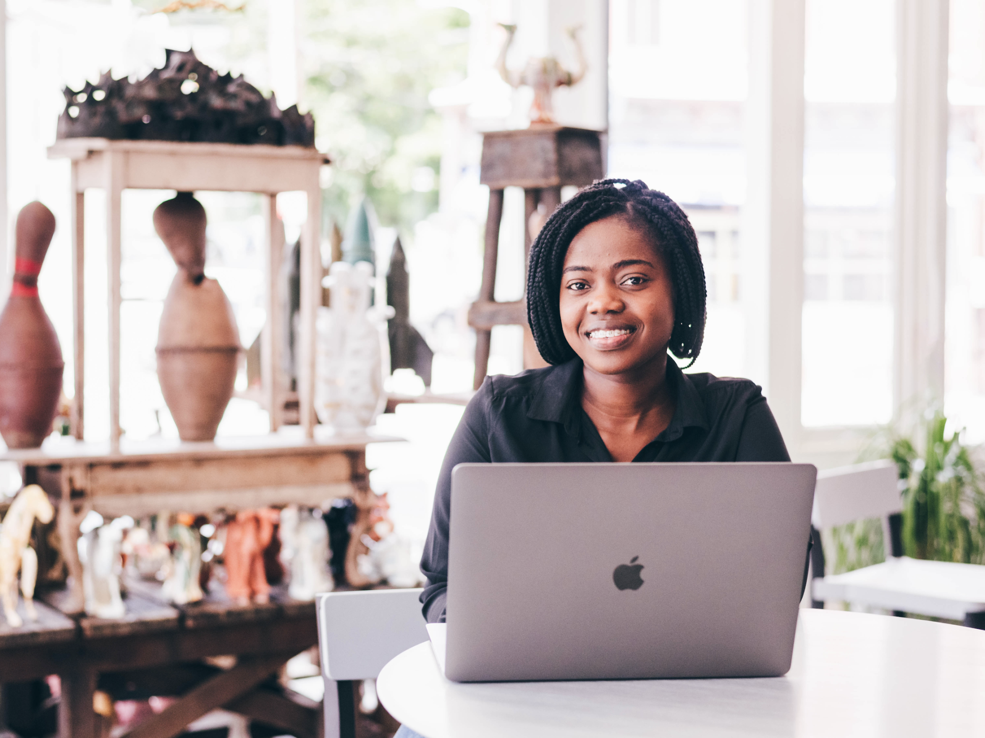 Jessica Ntim-Ofosu at her computer in Ernst & Young's Manayunk studio