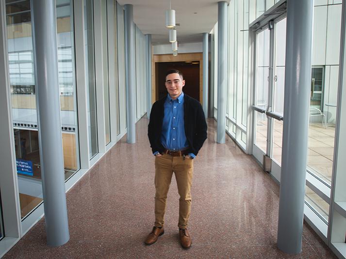 Josh Maldonado-Santiago stands in a hallway