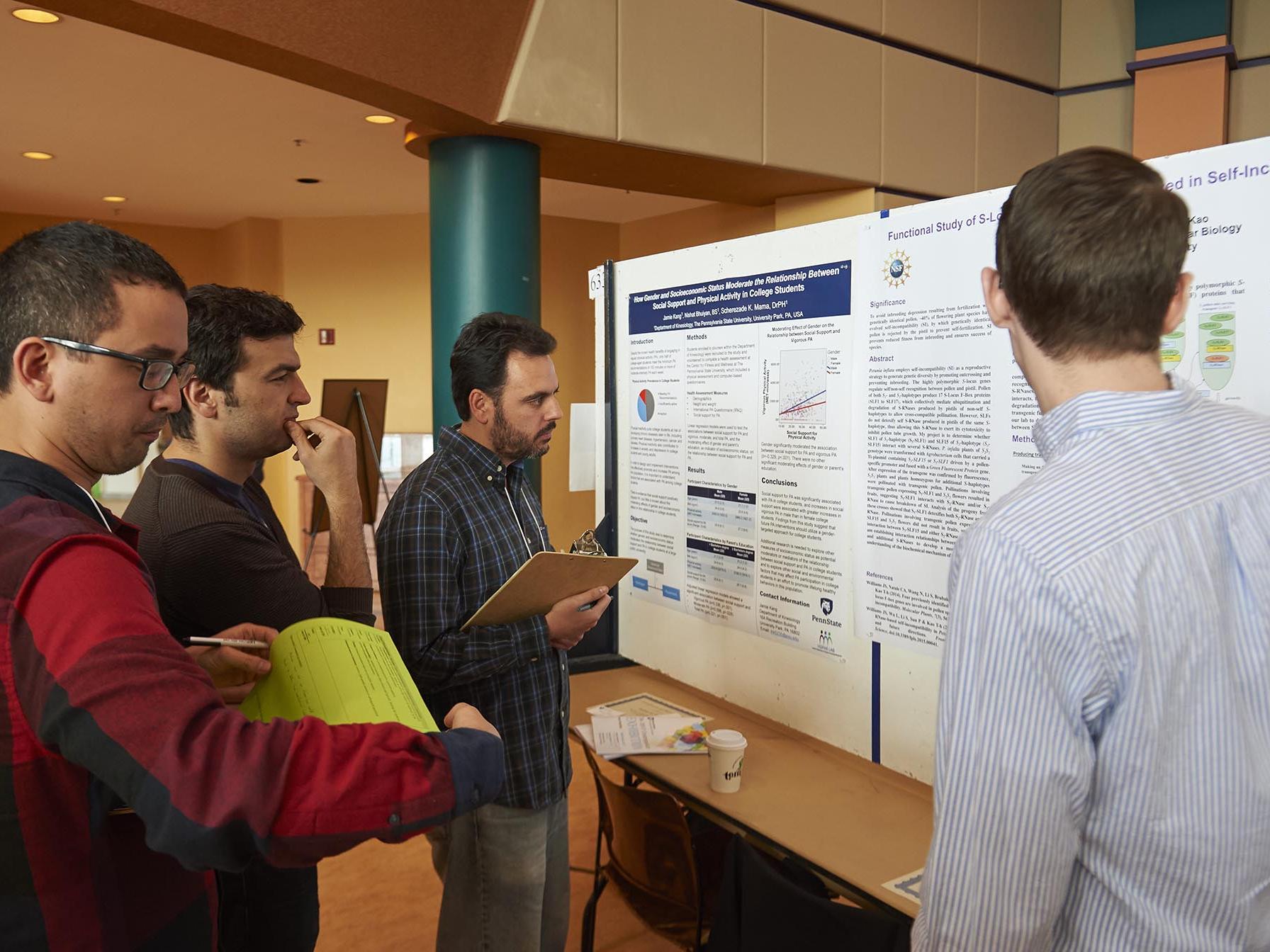 Judges examine poster