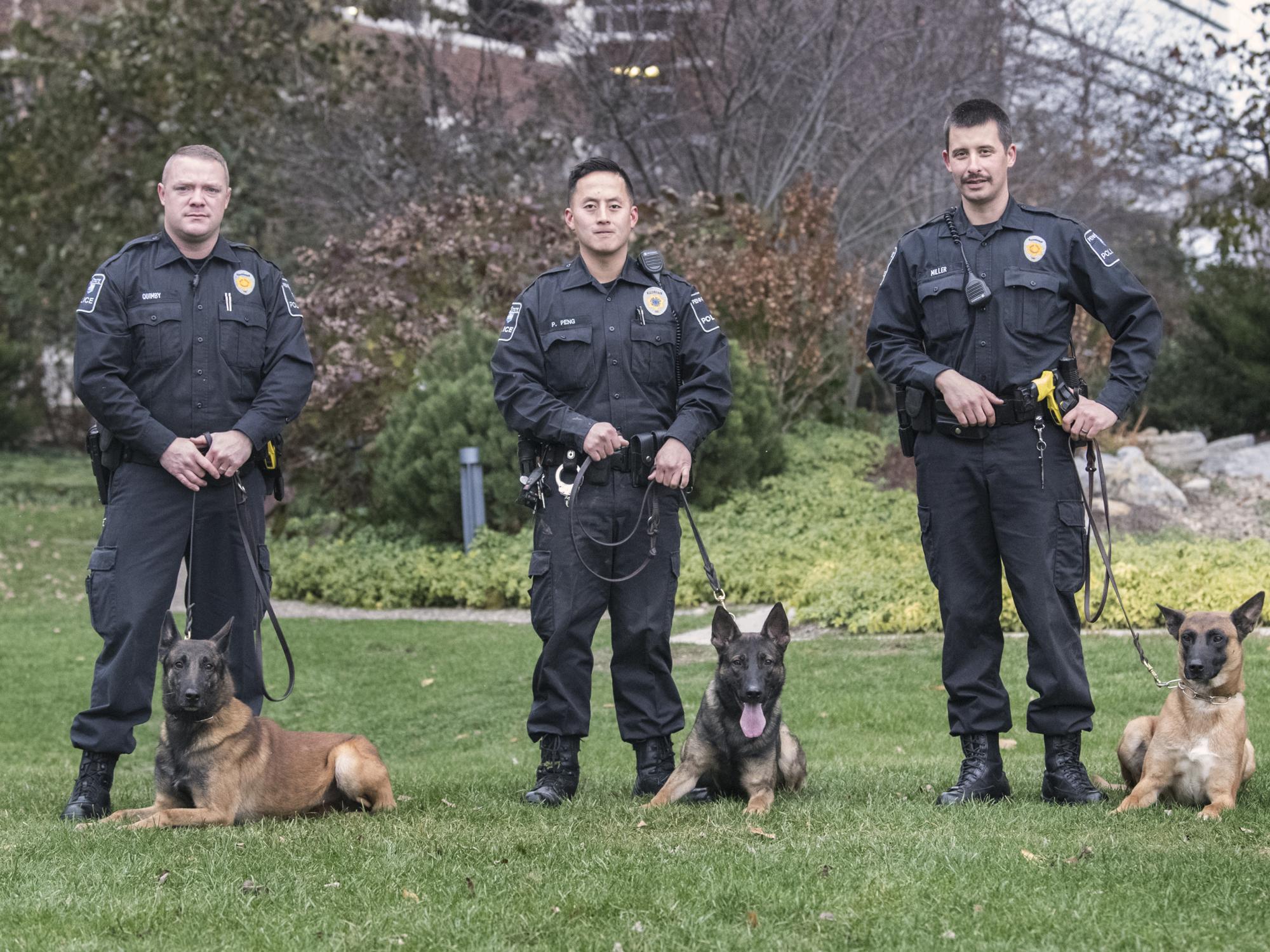 Officers pose outside with K-9 