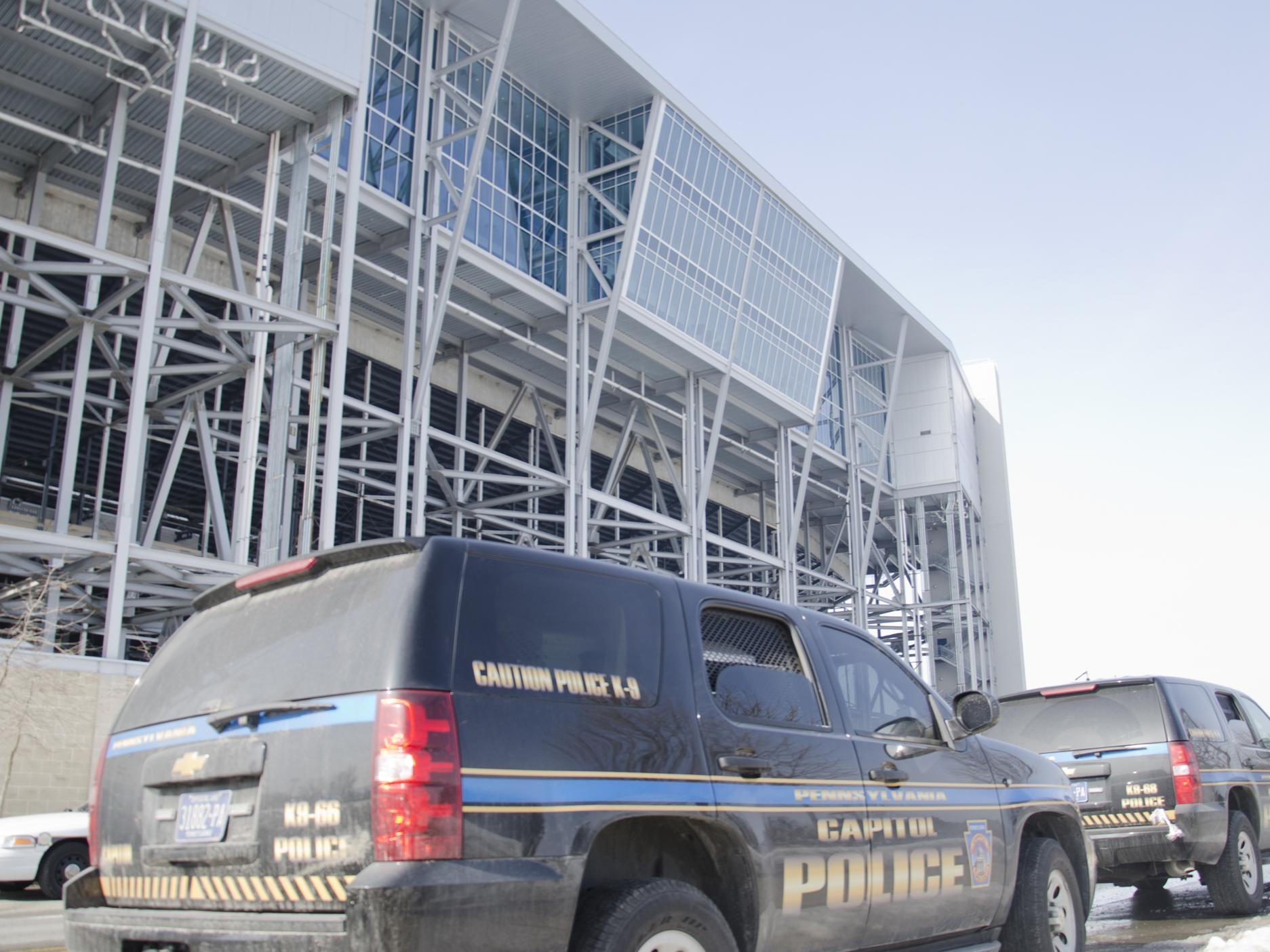 K-9 unit vehicles from the Capitol Police lined up outside Beaver Stadium