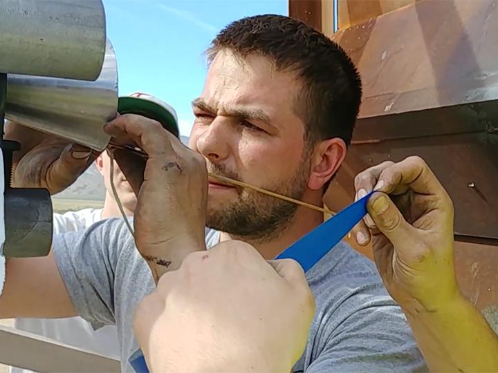 Kale Odhner makes the final adjustments to the rocket