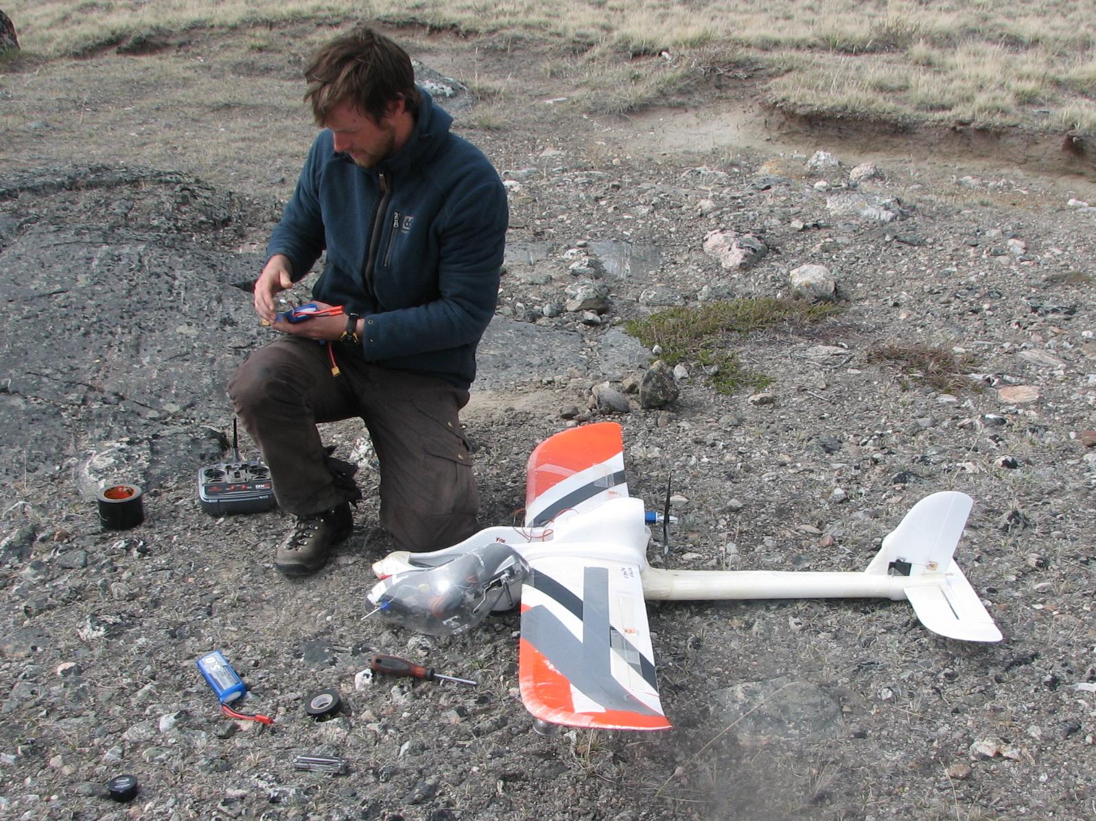 Kerby checks drone after flight