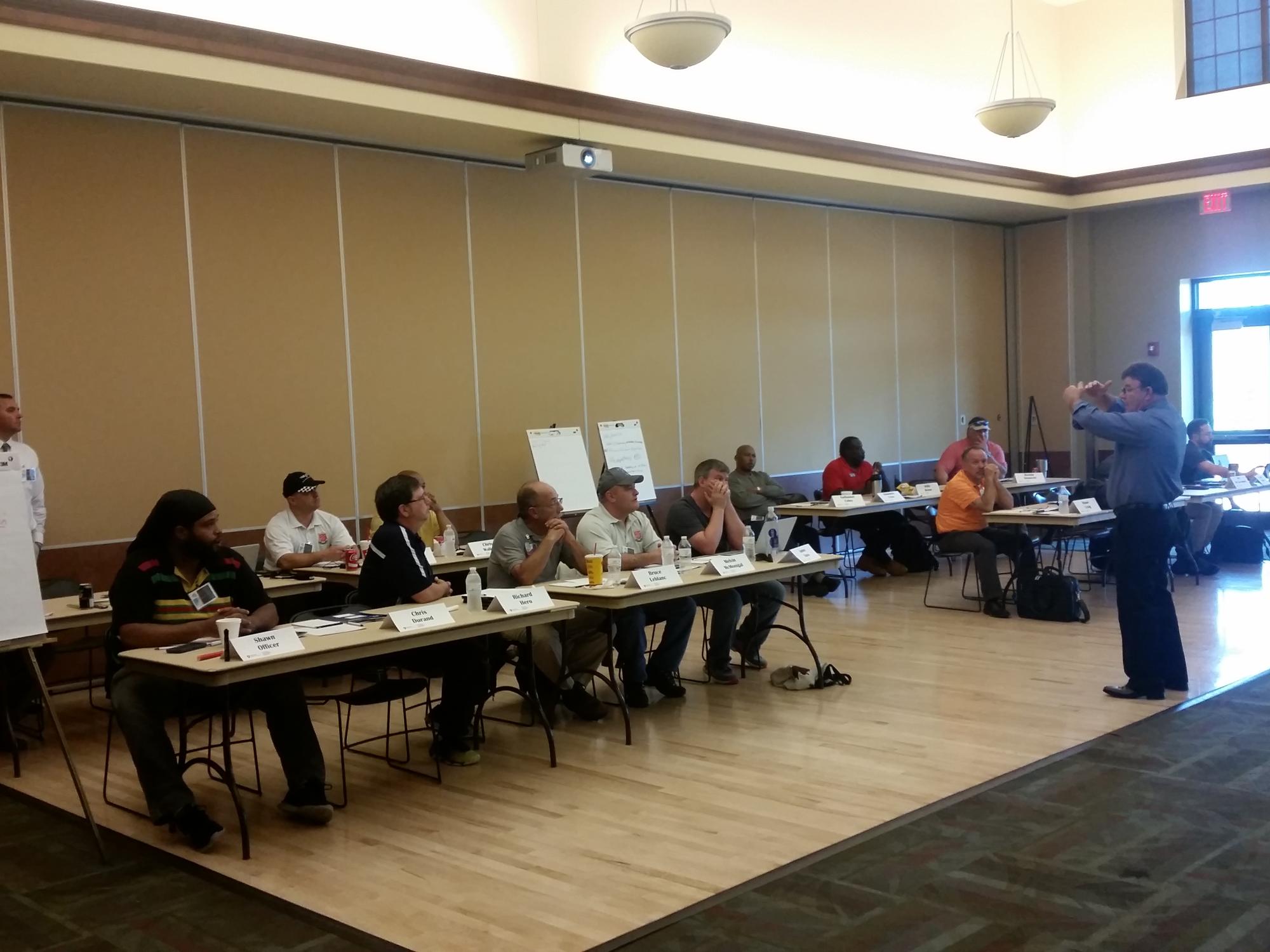 Instructor speaking to a room of students