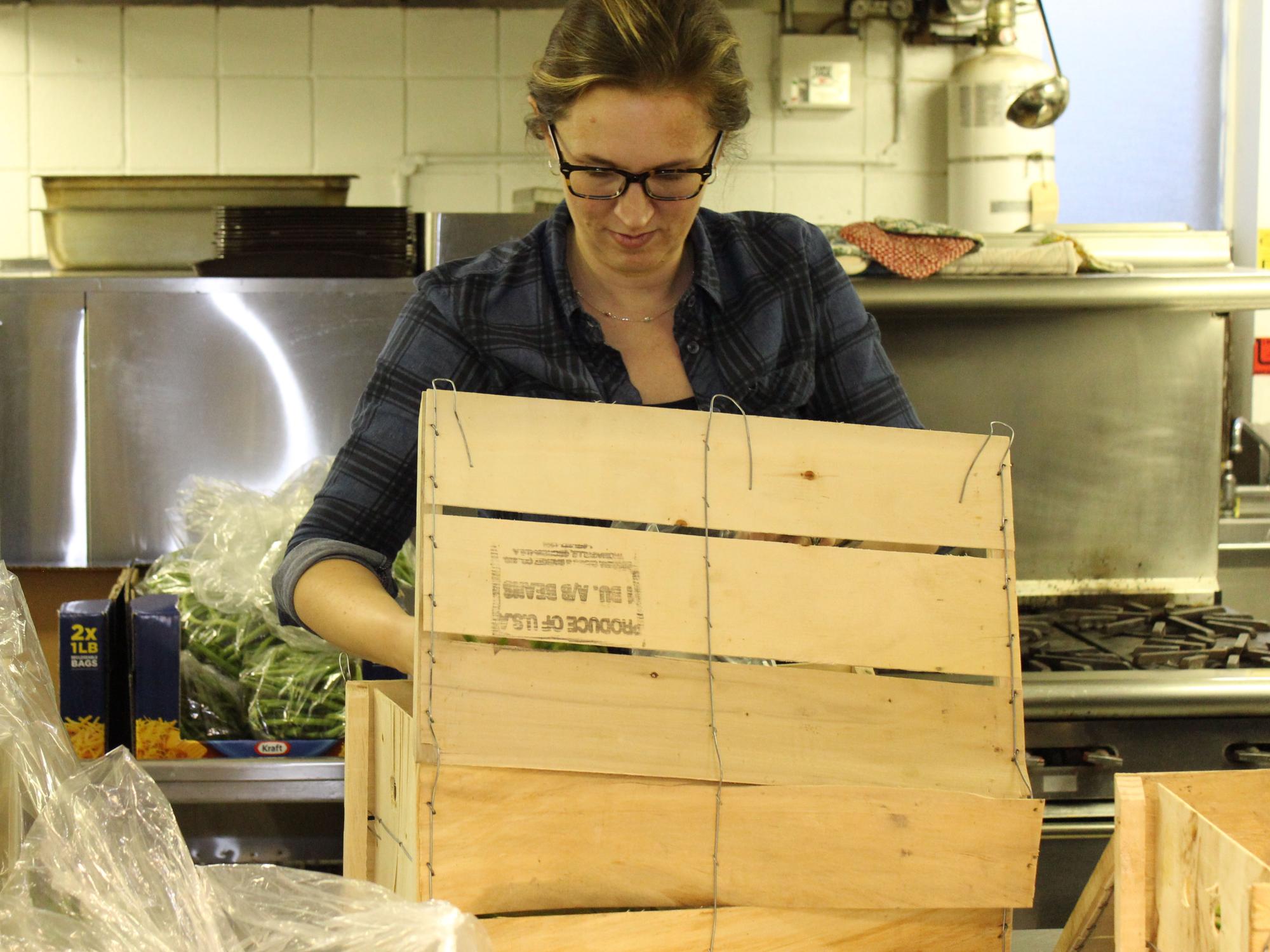 Greater Allegheny Employee packaging green beans