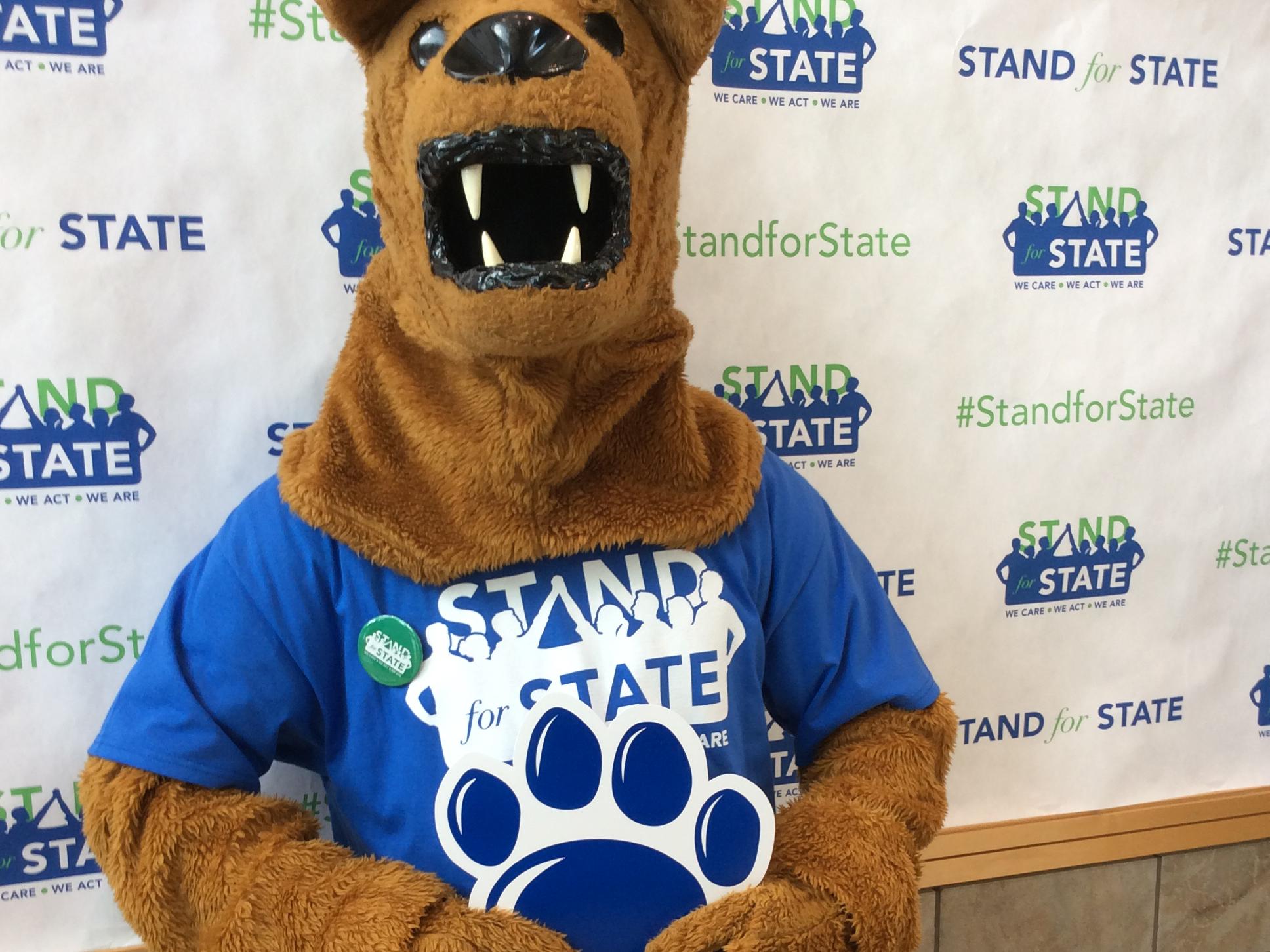 The Nittany Lion mascot wearing a Stand for State T-shirt