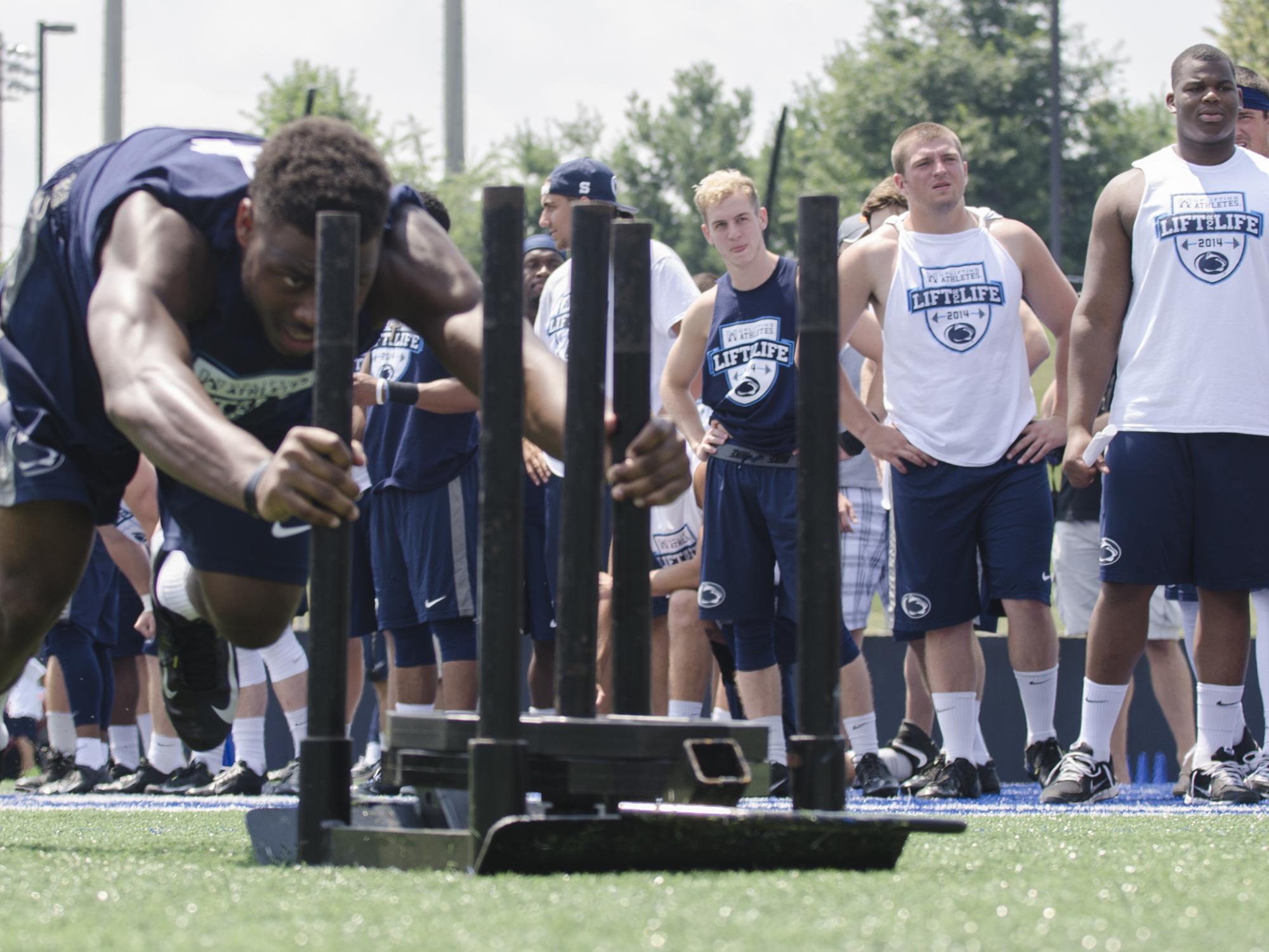 Adrian Amos competes in the sled push