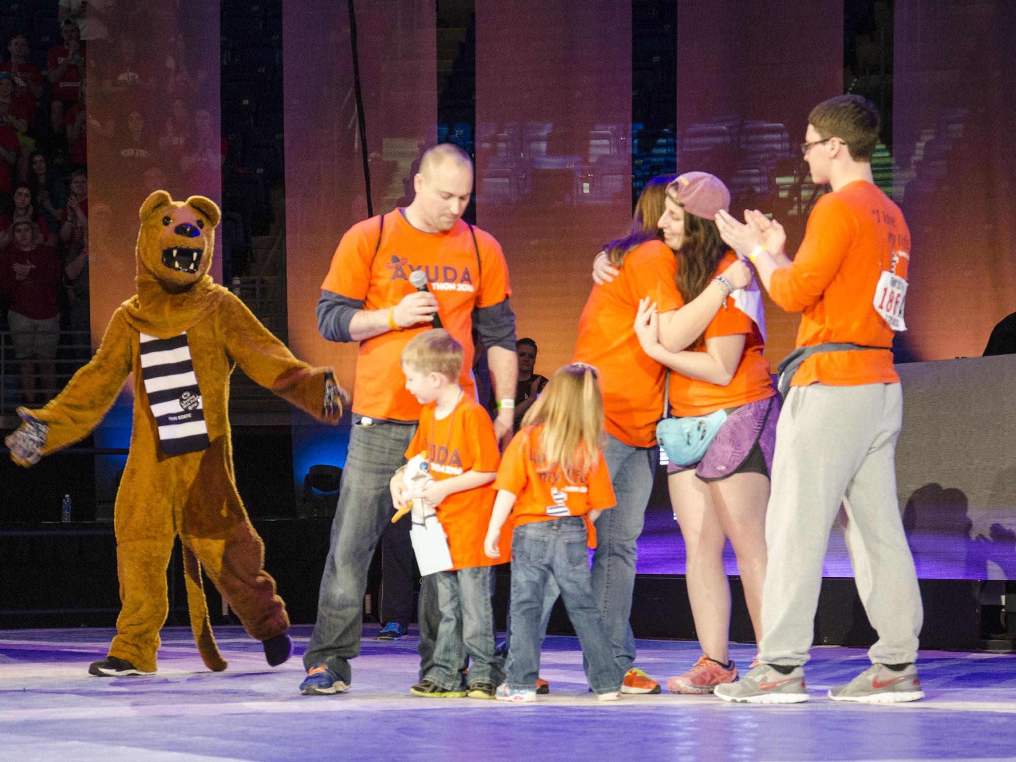 The Lion mascot greets a family at THON 