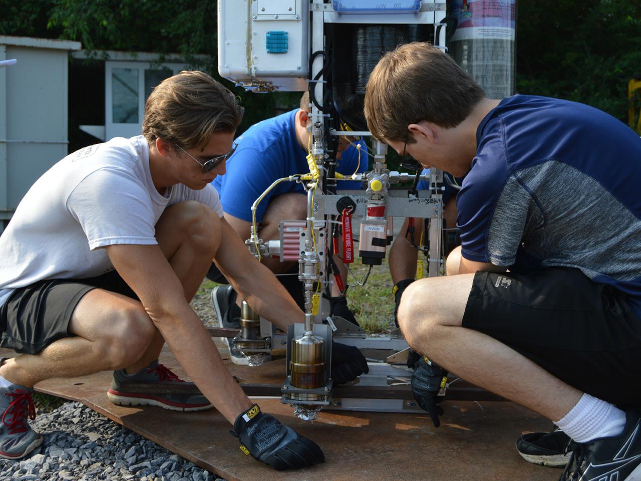 students working on testing equipment