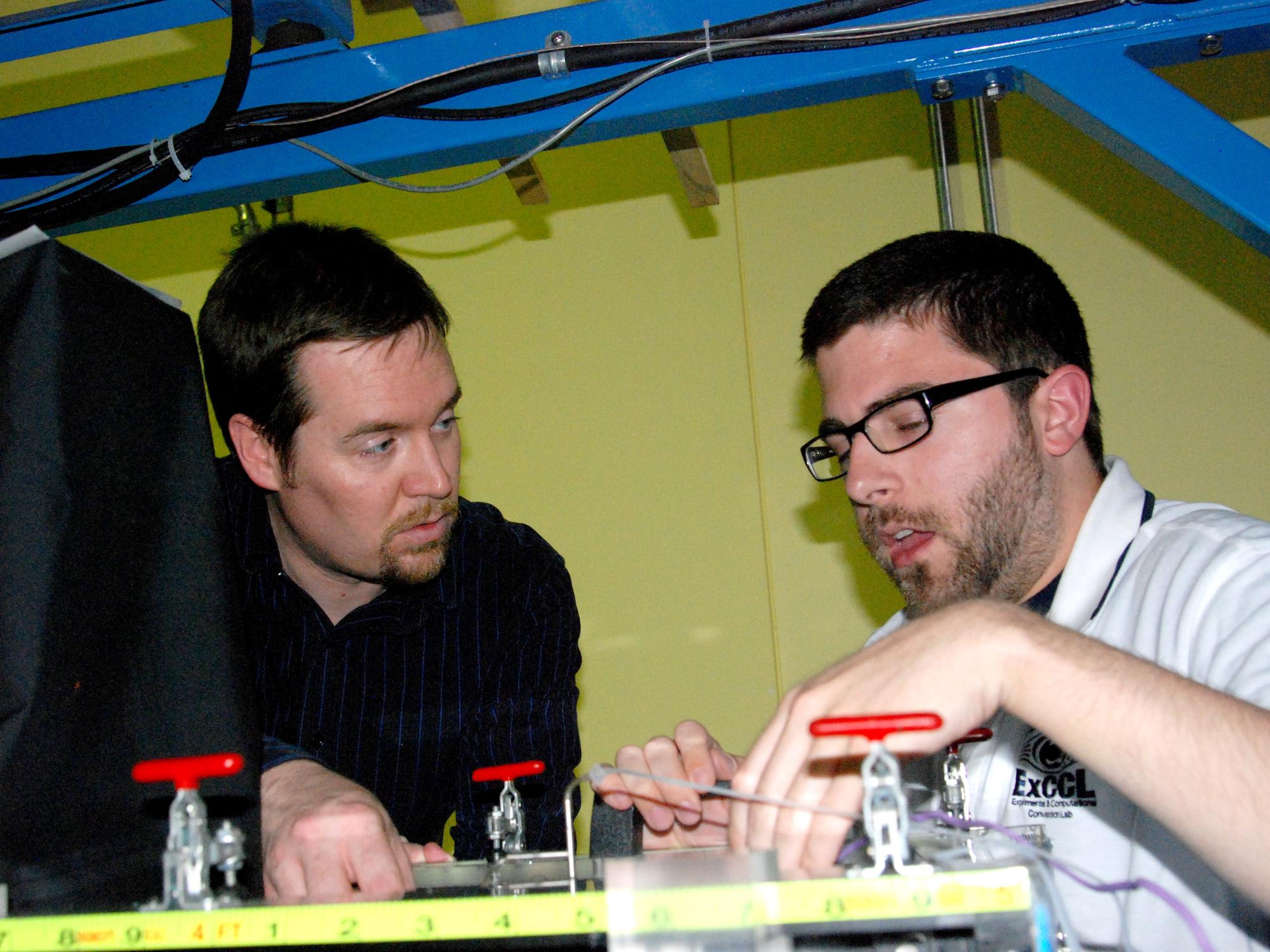 Stephen Lynch (left) works with a graduate student in the ExCCL lab. 