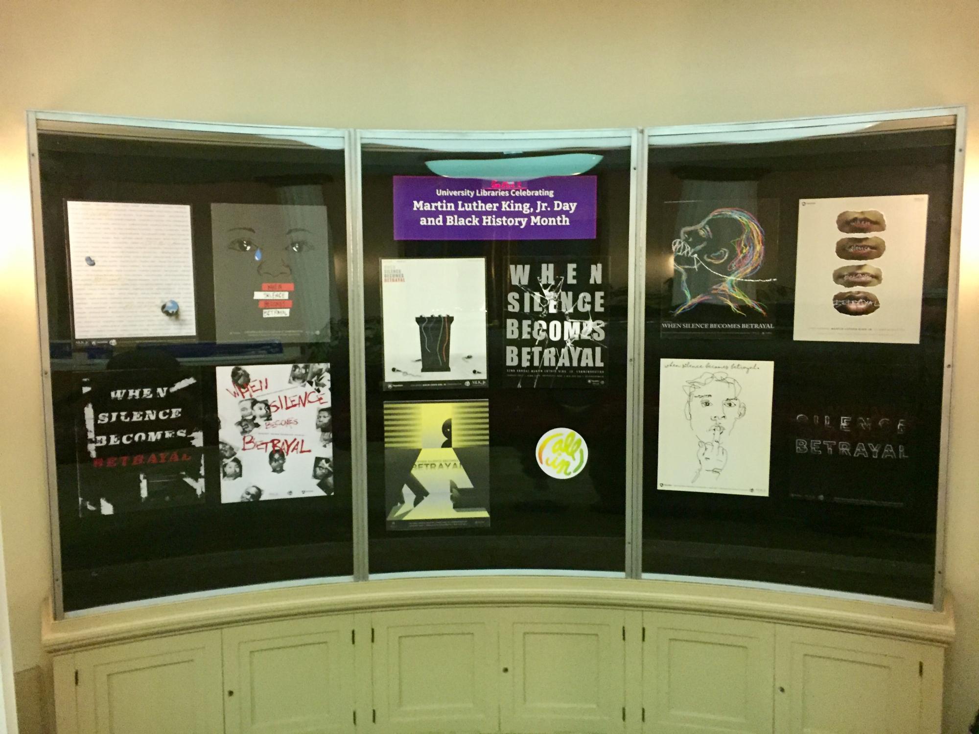 photo of display case showing 10 students' graphic design posters representing Martin Luther King Day at Penn State