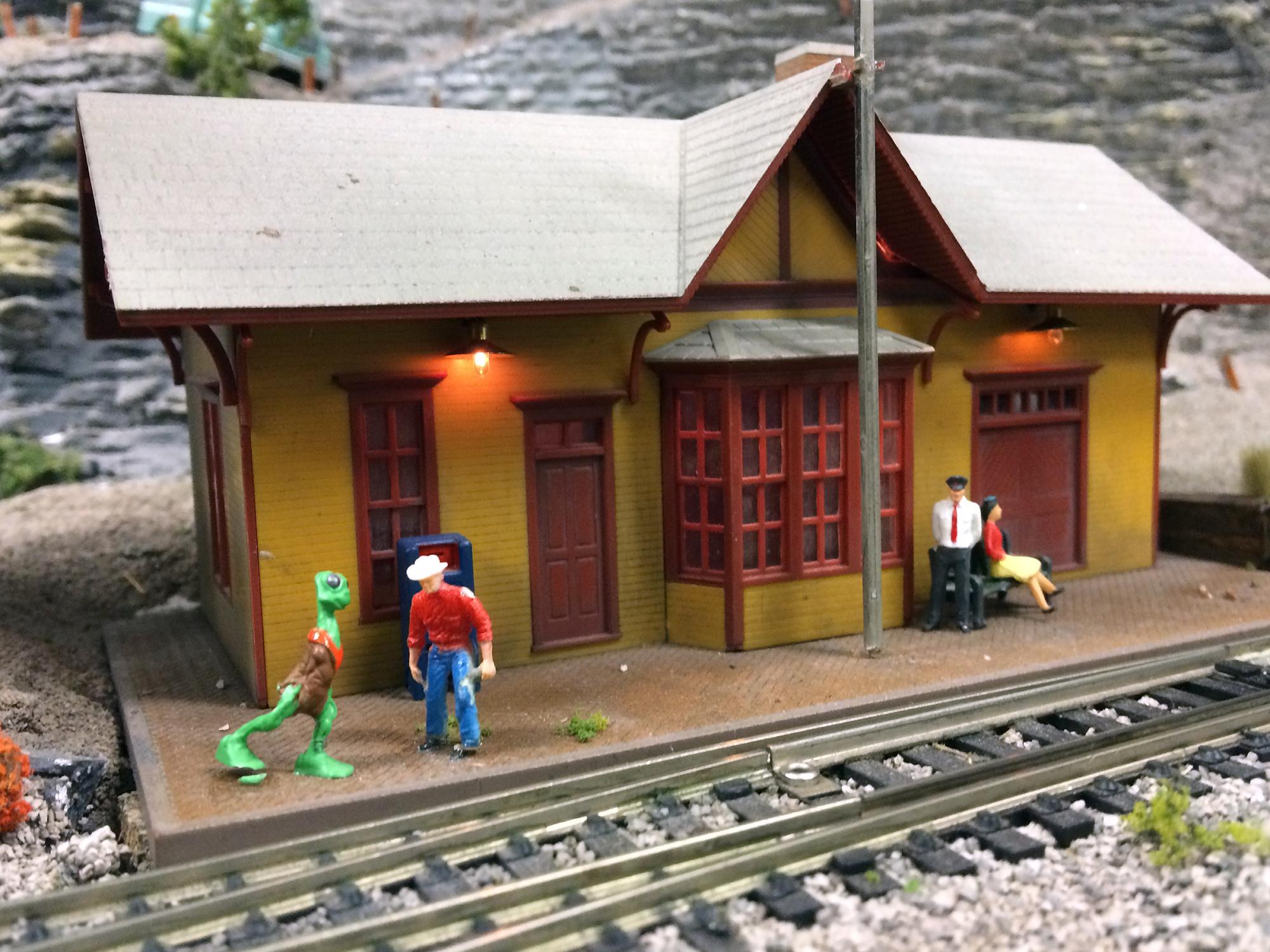 Model railroad alien versus cowboy