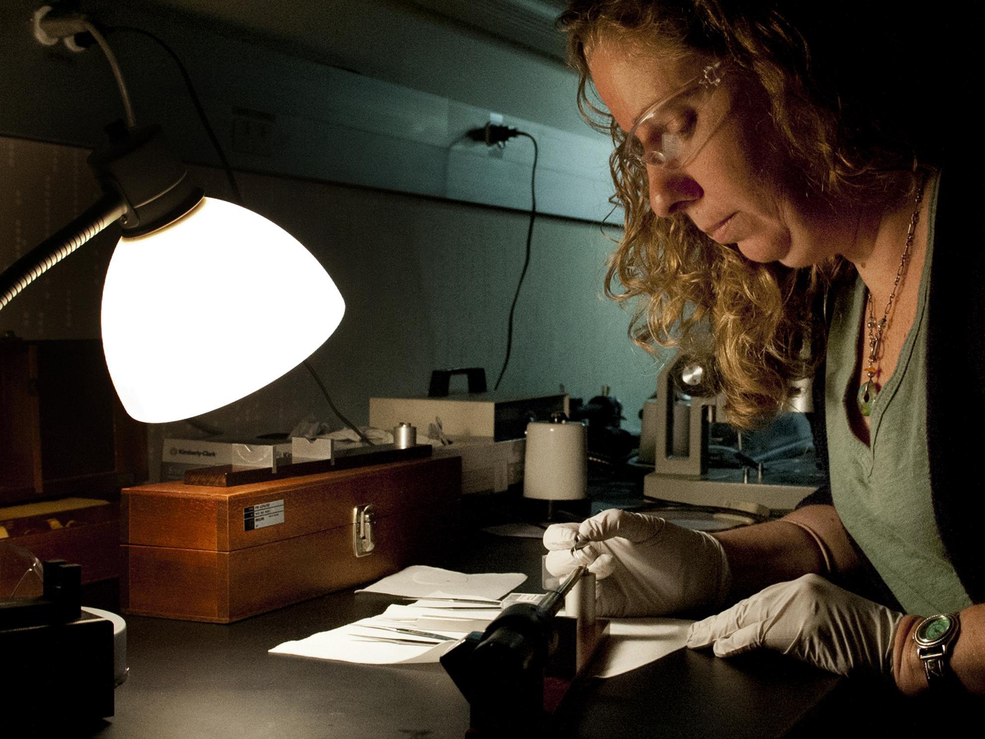 Research associate preparing a sample