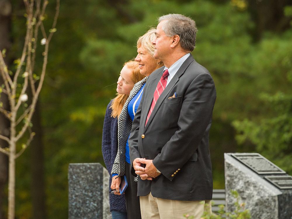 Family members watch the dedication of the Mary Behrend monument.