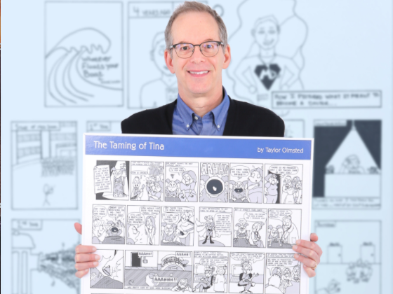 Michael Green holding comic poster