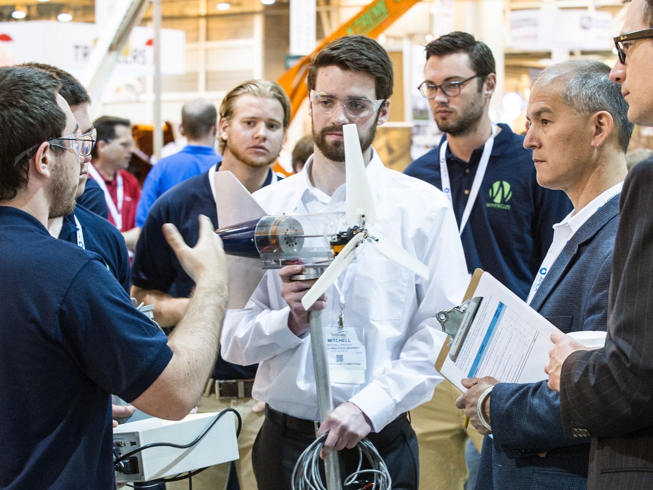 Penn State Wind Energy Club members discuss their turbine design with U.S. Department of Energy Collegiate Wind Competition