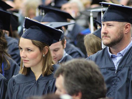 Penn State Mont Alto graduates wait to receive their diplomas.