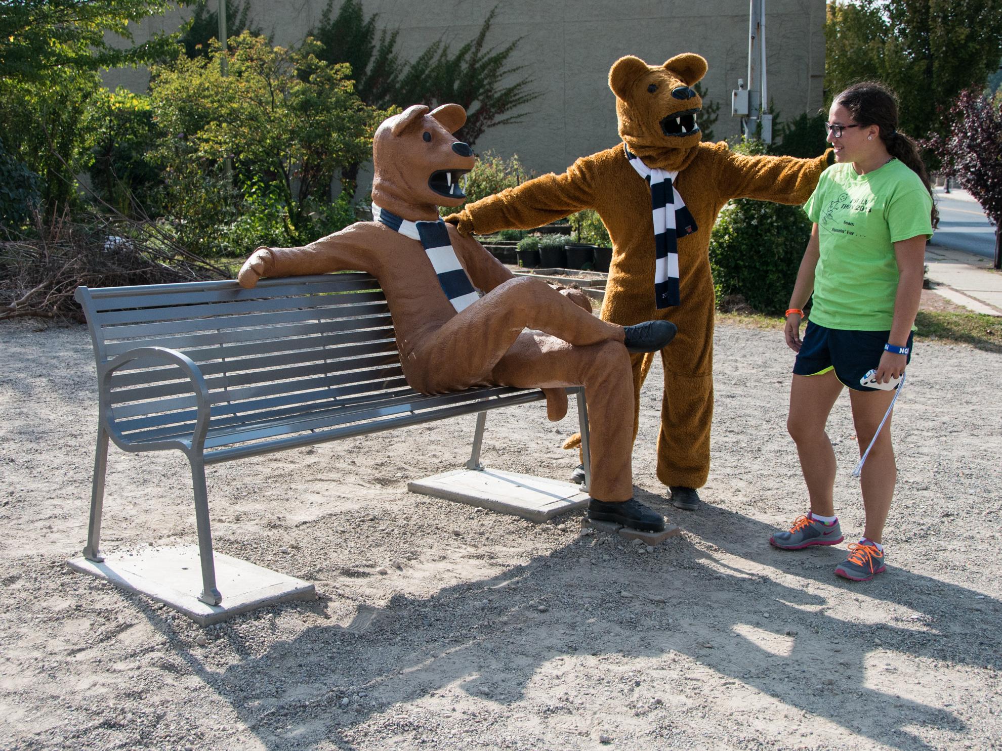 A student and the Nittany Lion mascot check out the Nittany Lion bench in Bethlehem.