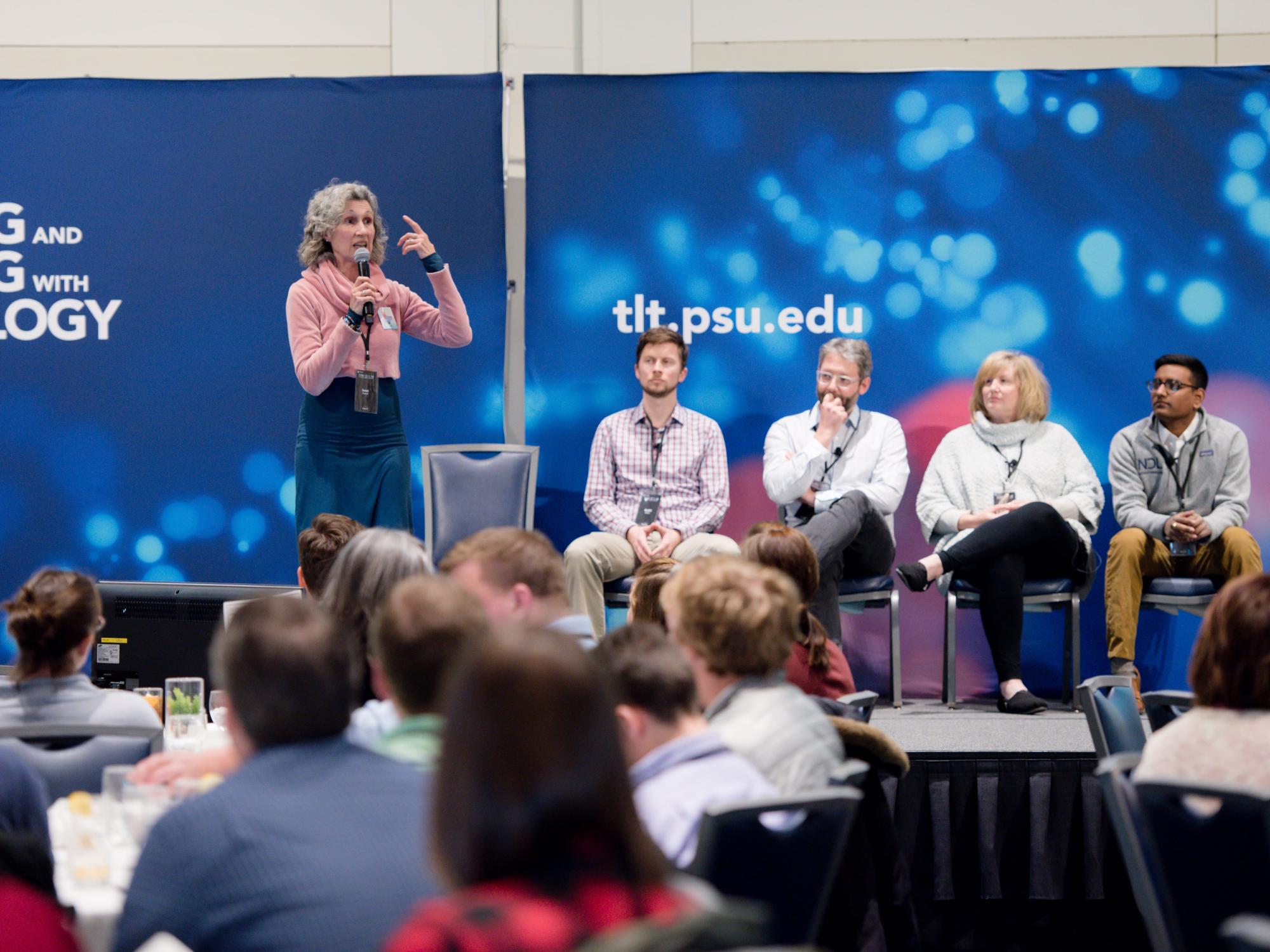 Susan Russell presents while other presenters listen
