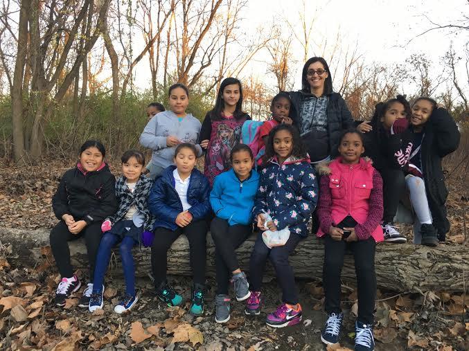 Laurie Grobman stands with the children in her hiking club
