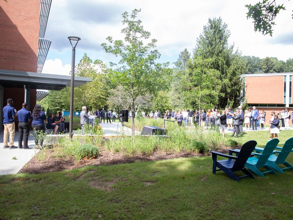 A photo of a crowd of people standing in front of the Ostermayer Laboratory