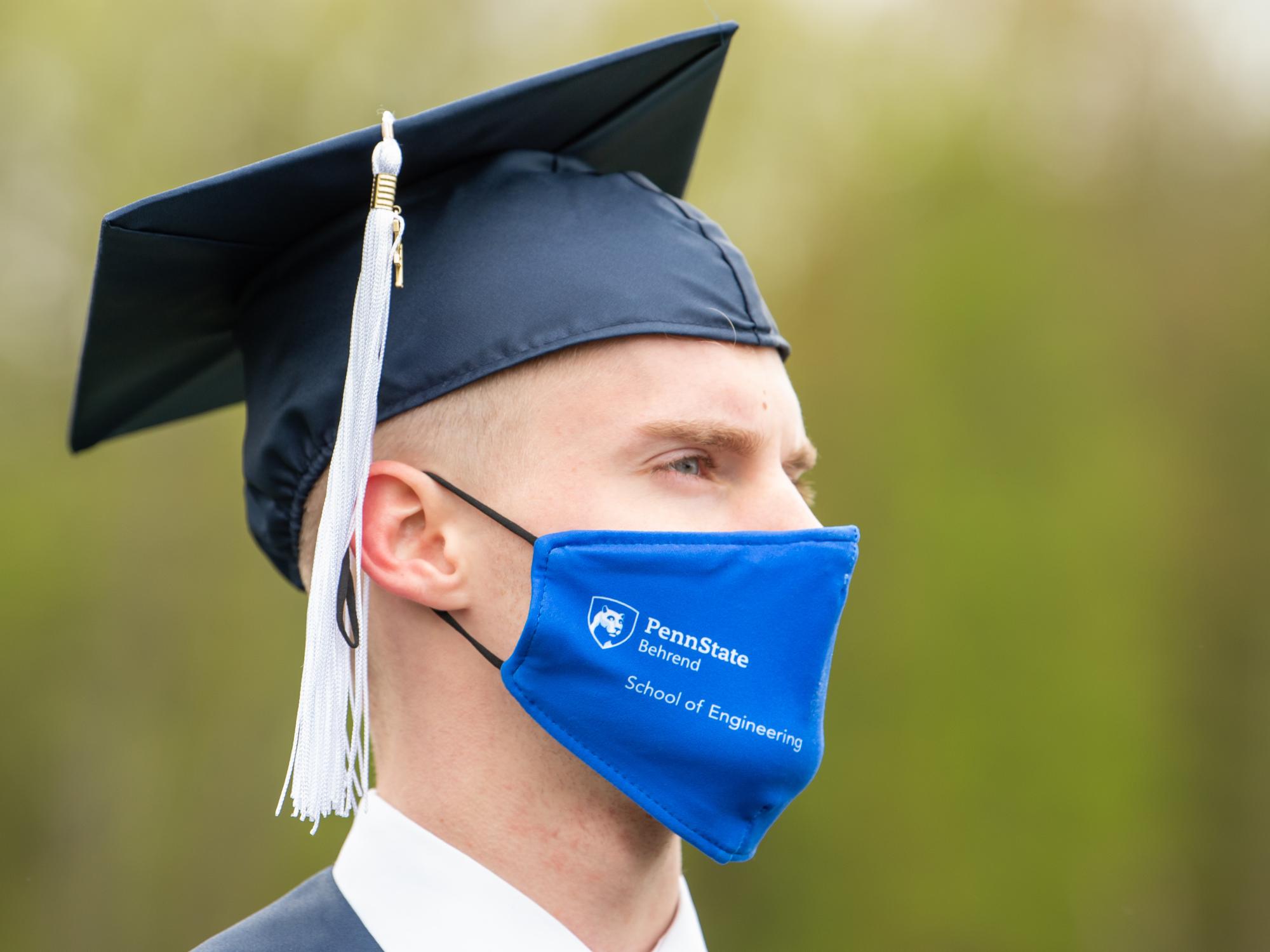 A close-up photo of a Penn State Behrend graduate at commencement.