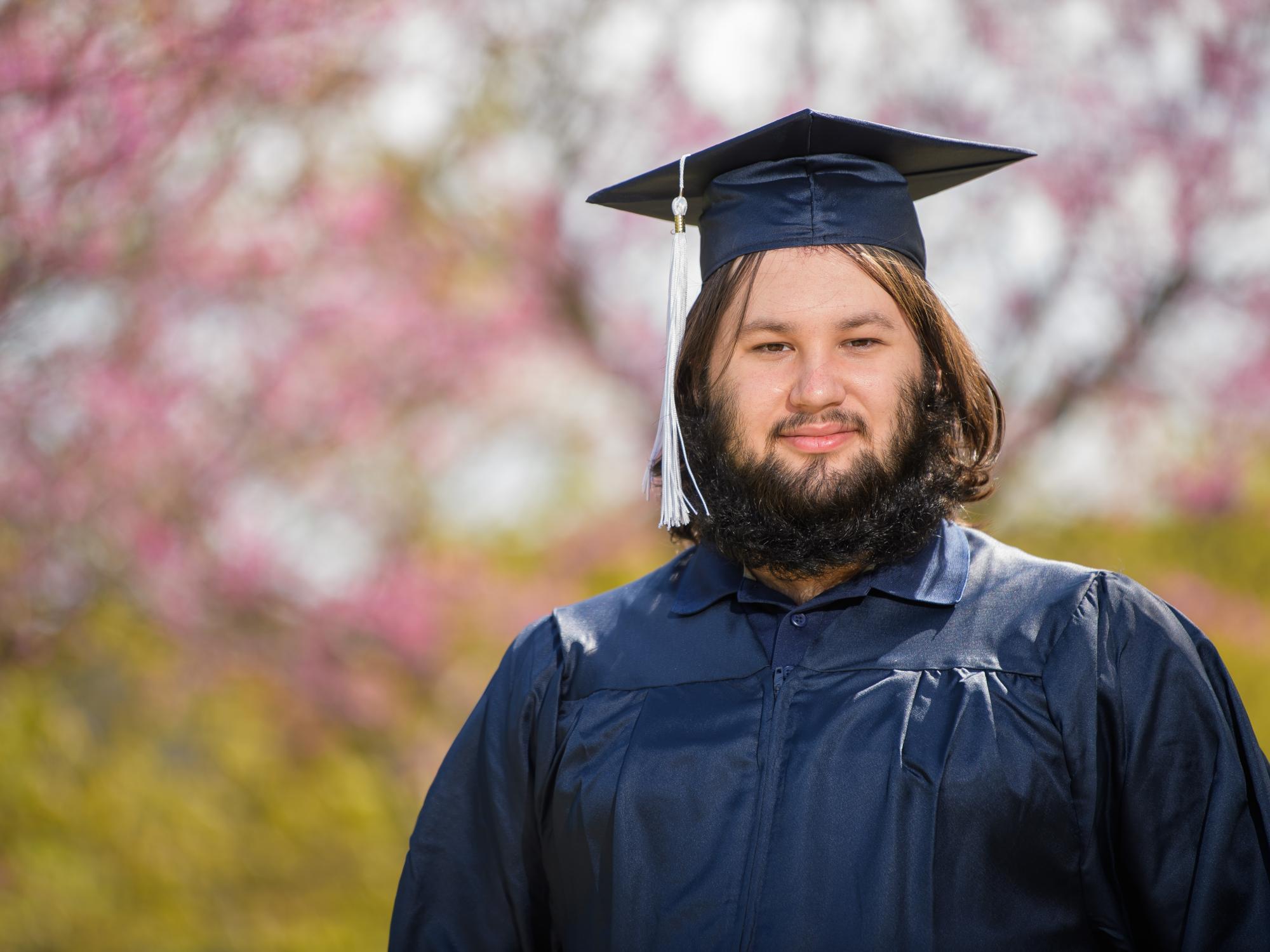 A portrait of Penn State Behrend graduate Mason deHénaut