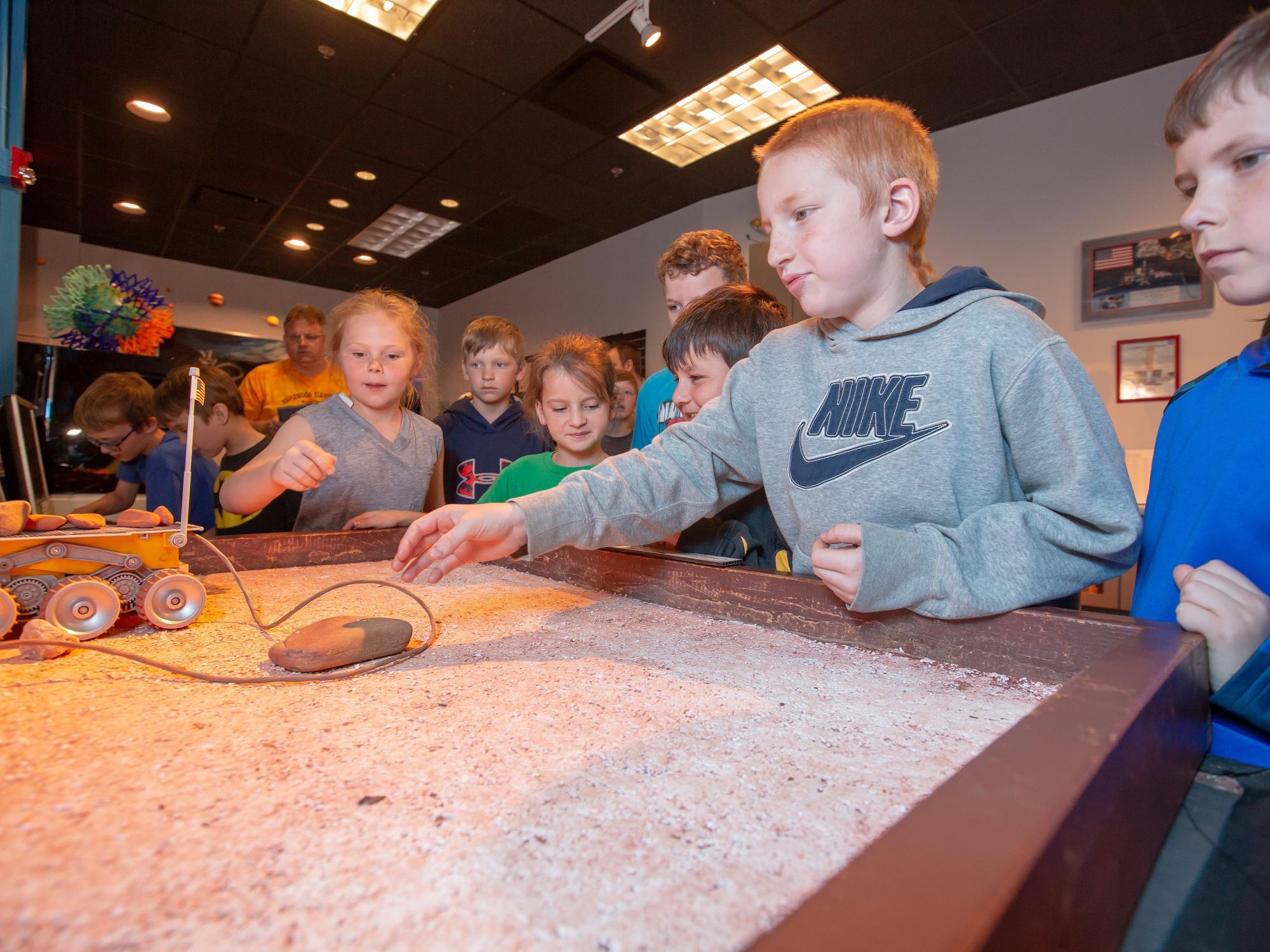 The Yahn Planetarium at Penn State Behrend offers several hands-on activities, including the remote-controlled miniature lunar rover pictured here.