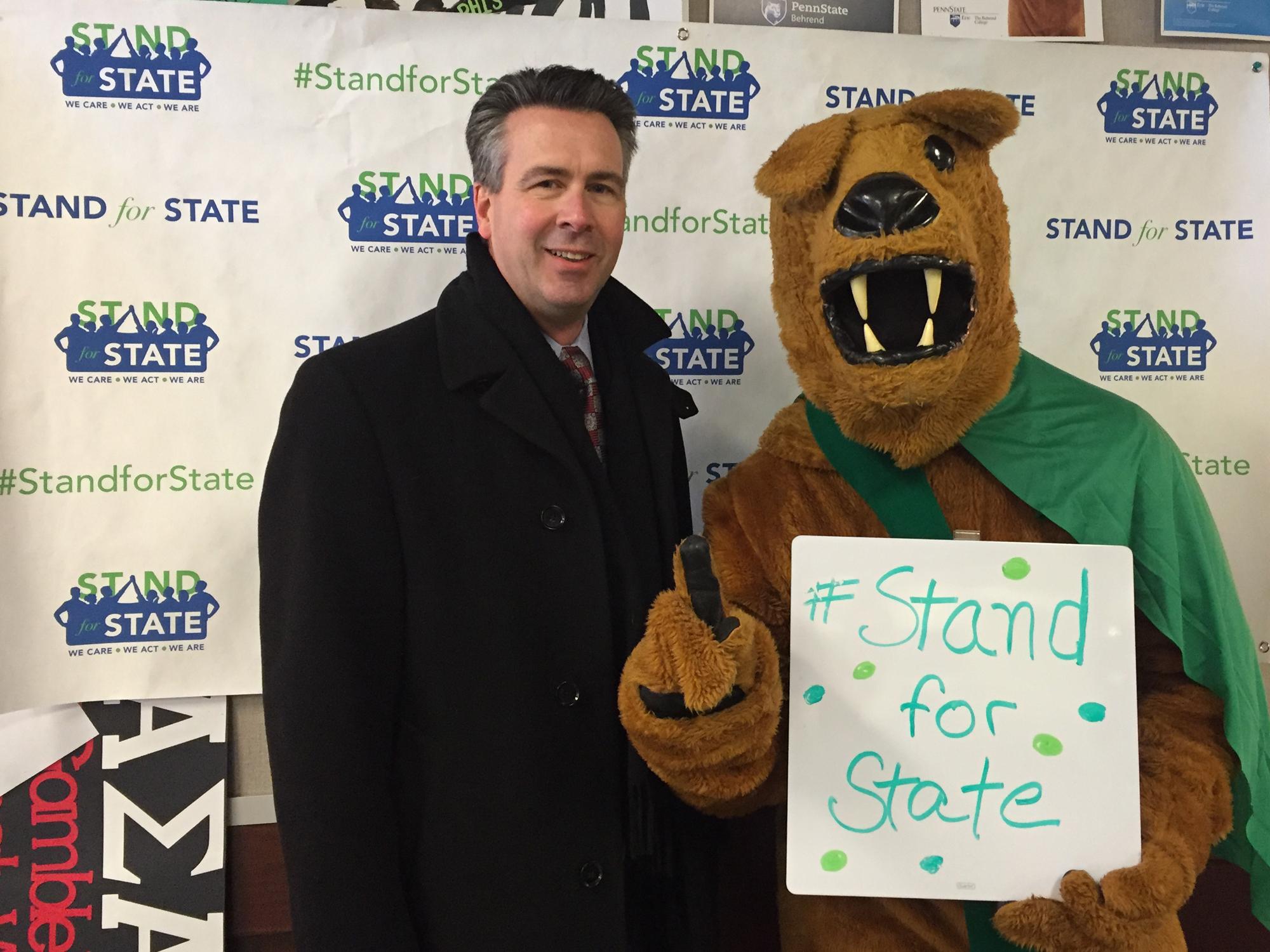 Penn State Behrend Chancellor Ralph Ford and the lion mascot 