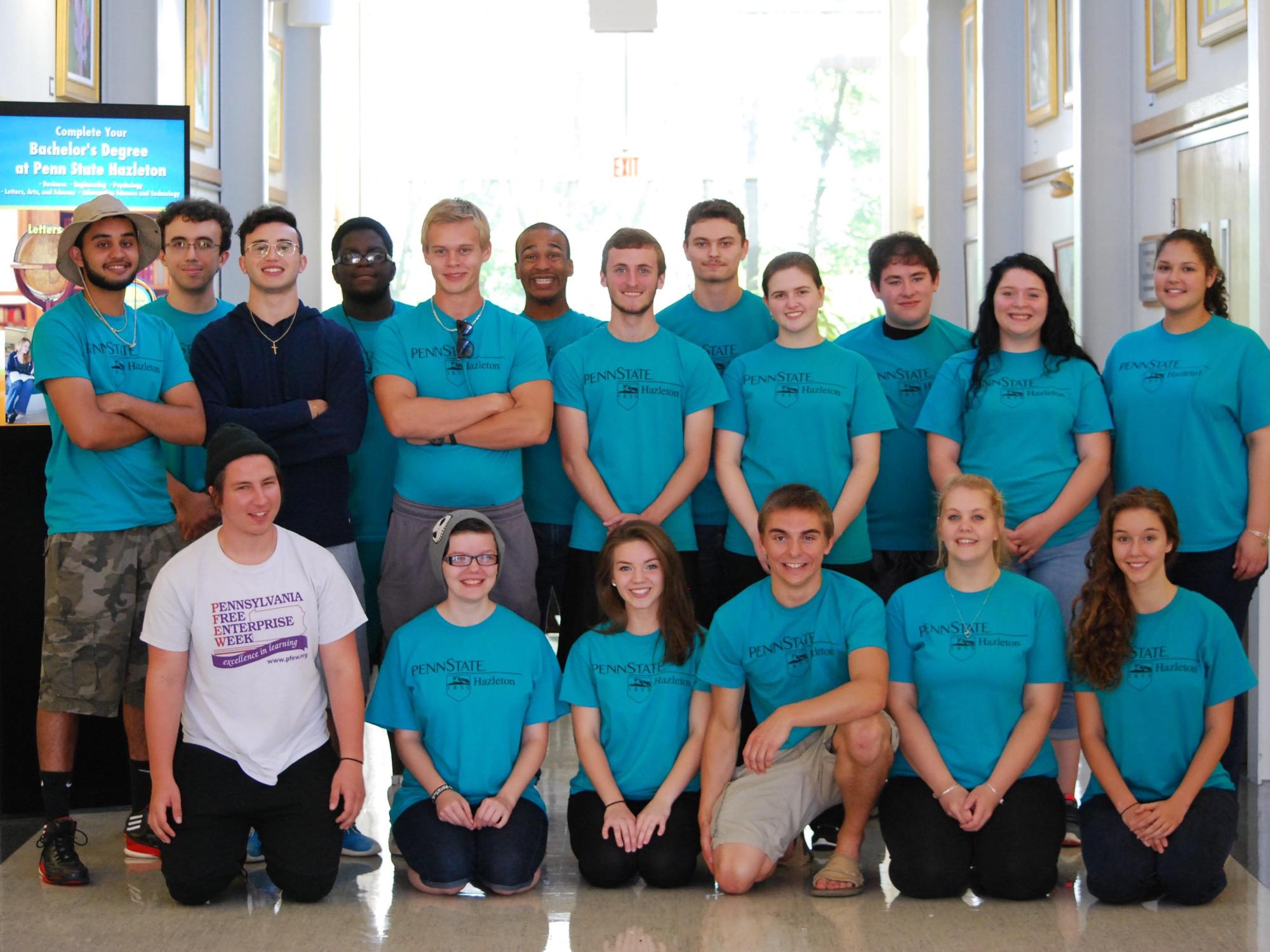 student group poses in PaSSS t-shirts