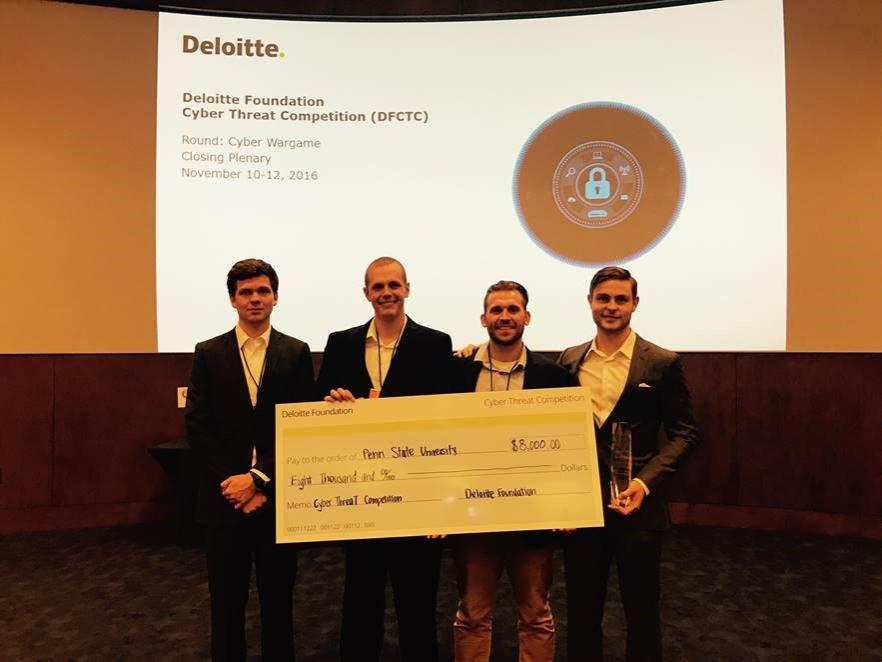 Kevin Houk, Michael Morelli, George Beatty and Michael Lubas with their prize from the third annual Deloitte Foundation Cyber Threat Competition. 