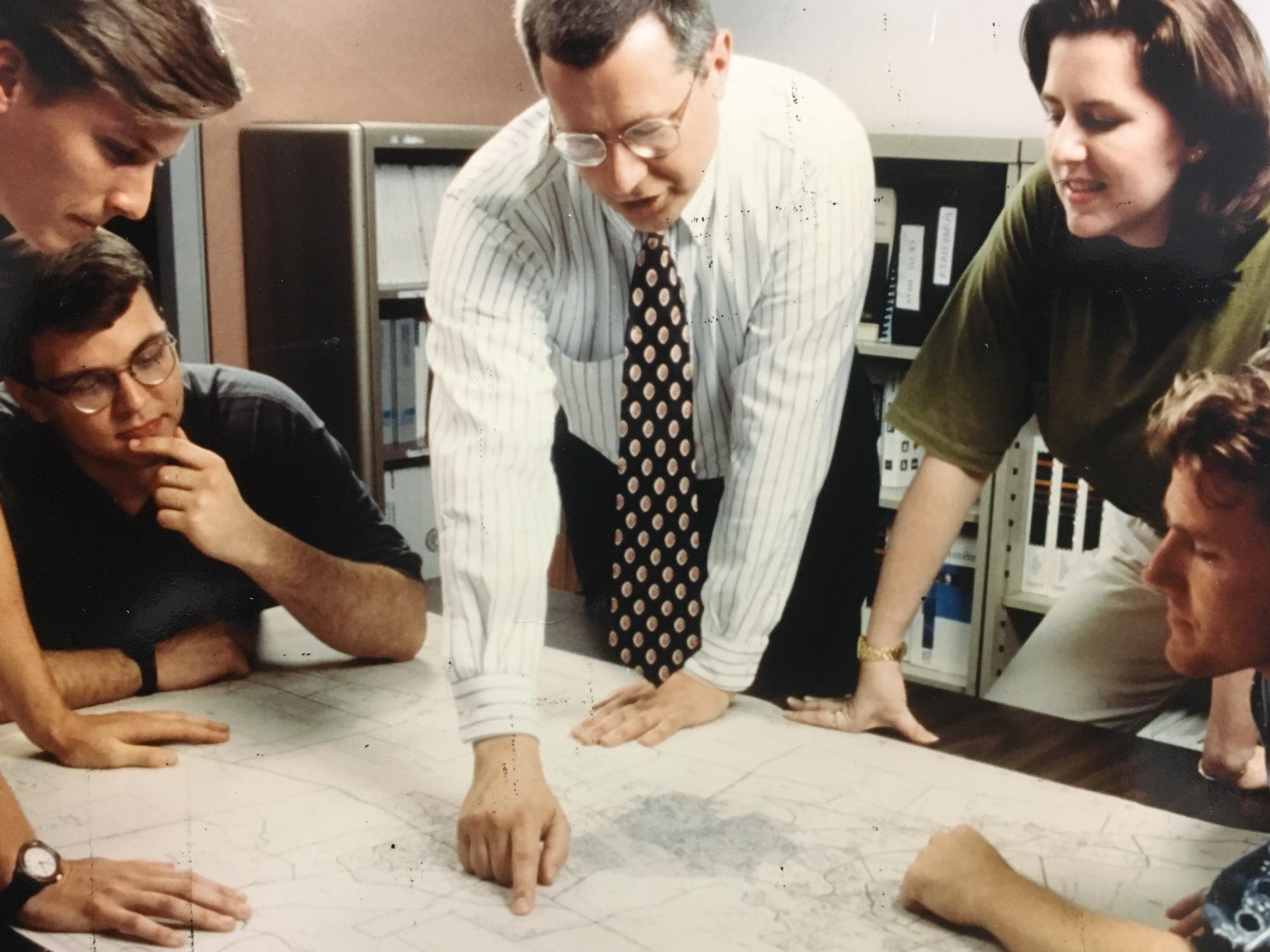 Professor and students discussing a project