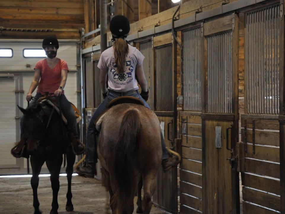 Students riding horses