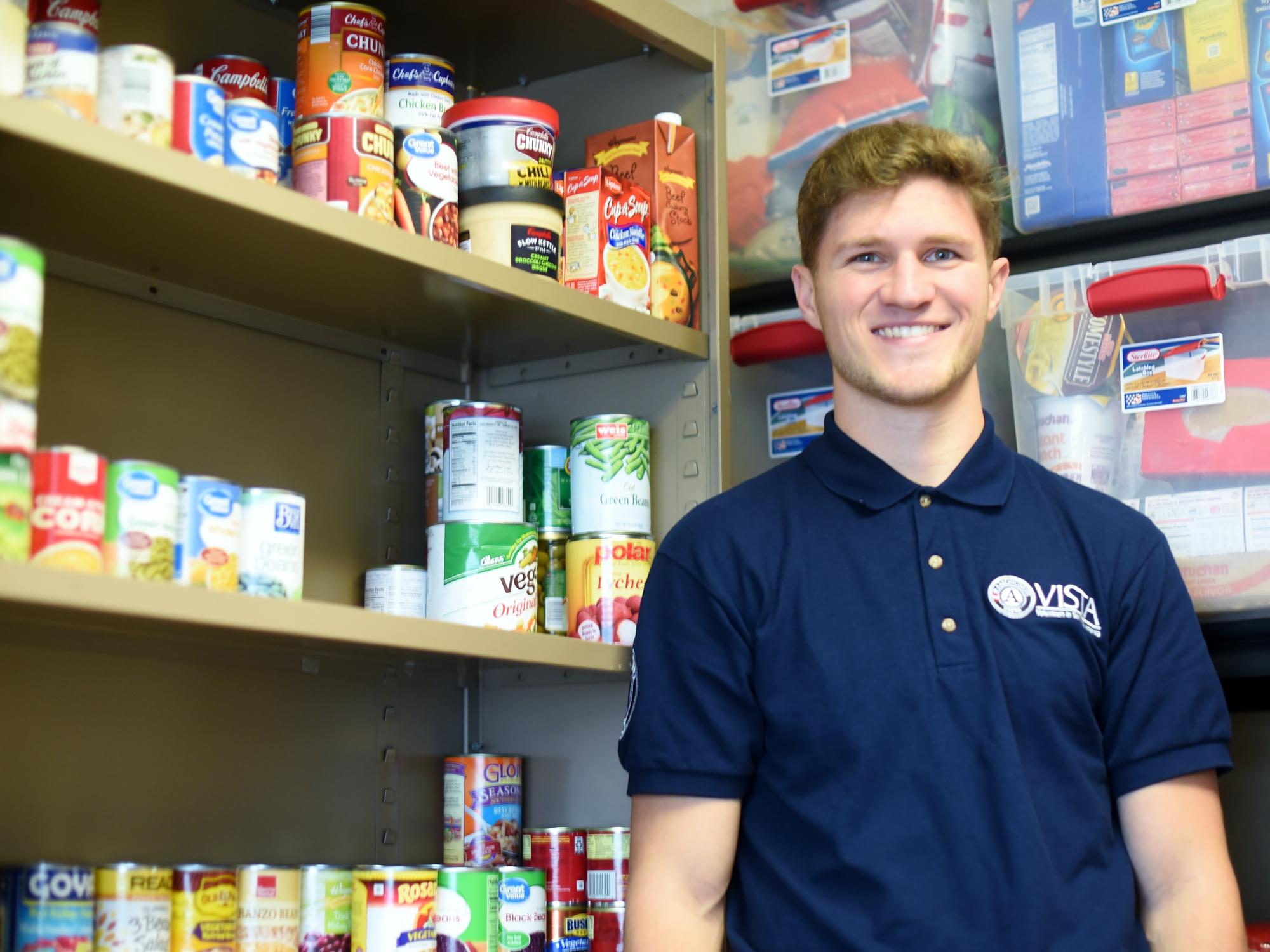A portrait of AmeriCorps VISTA member Rob Felger in the Penn State Behrend Lion's Pantry.