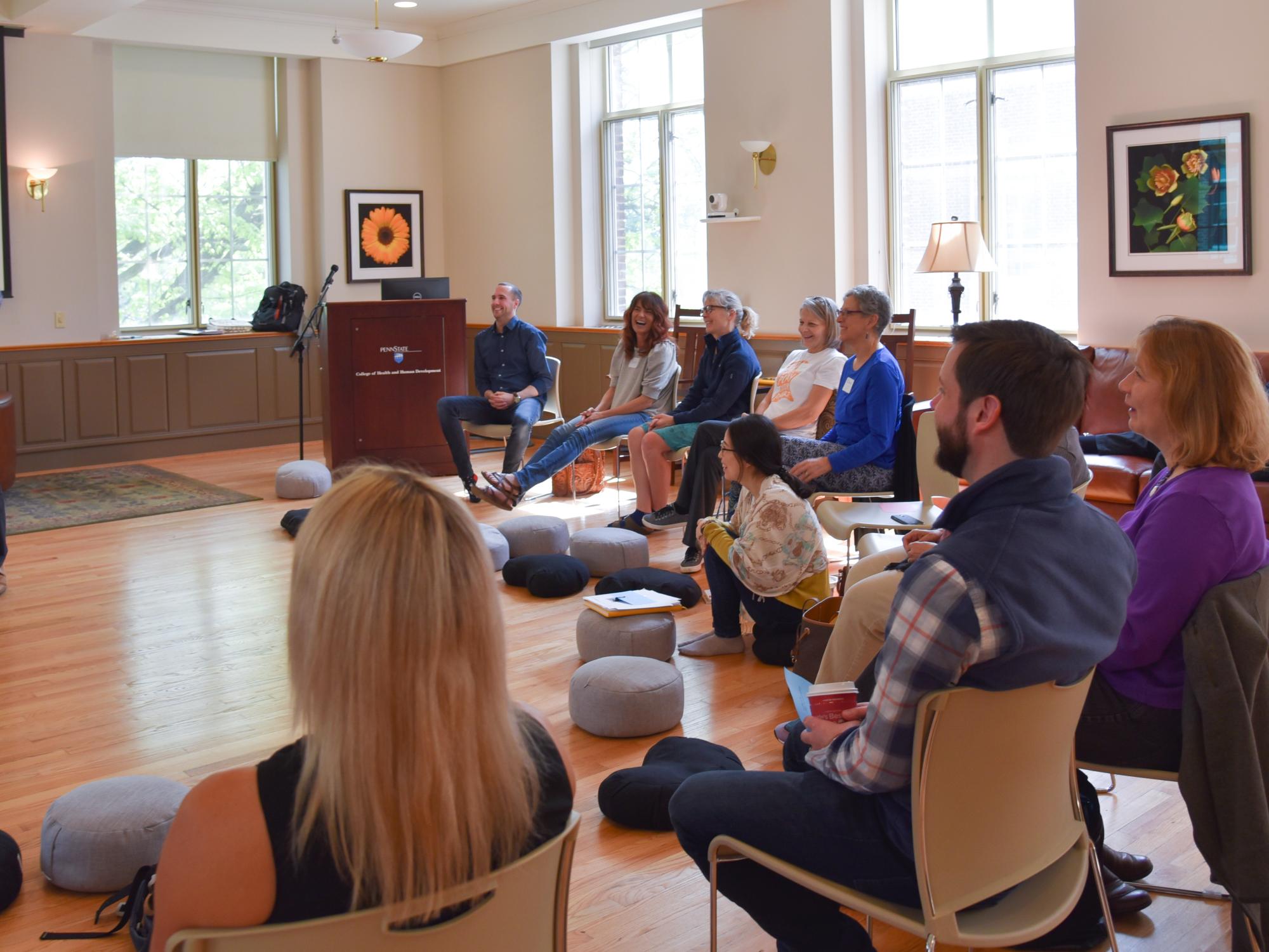 professor lectures to group of educators seated in a semi-circle