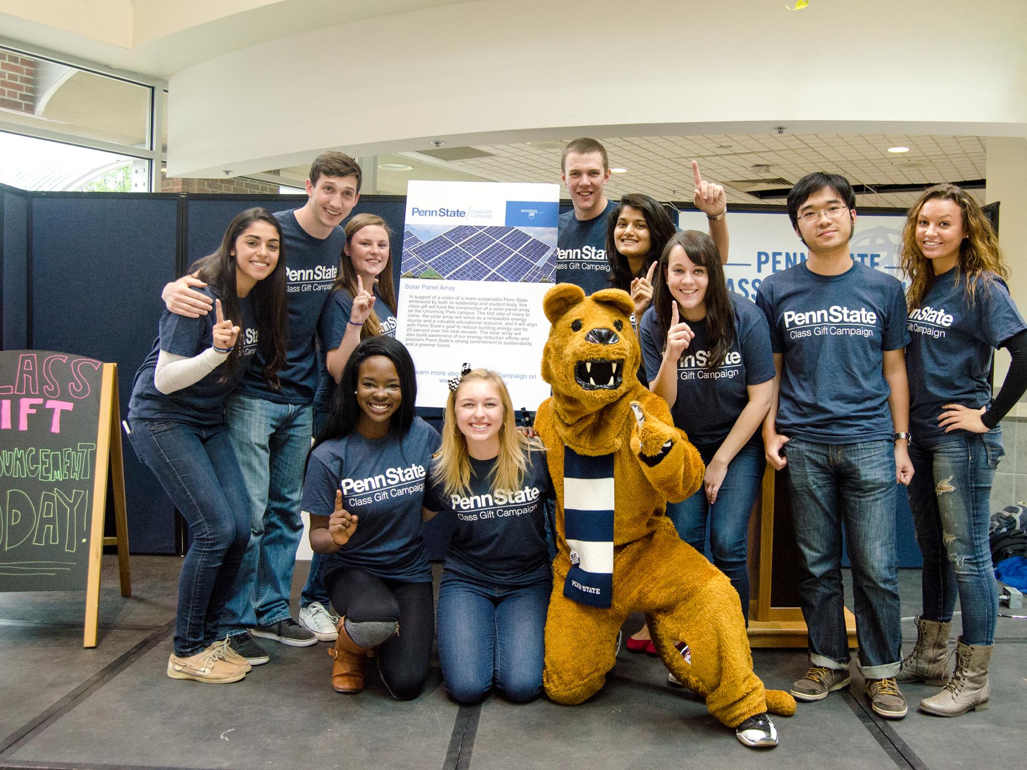 A group of students and the Nittany Lion pose with the 2015 class gift announcement.