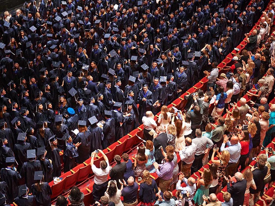 Family members applaud the members of the Schreyer Honors College's graduating class