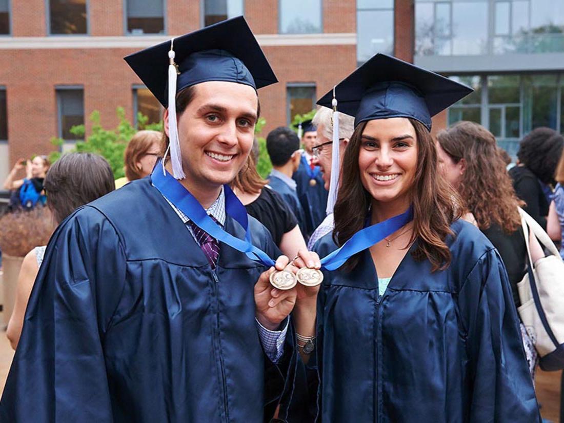 Two graduating Schreyer Honor College students pose with their medals