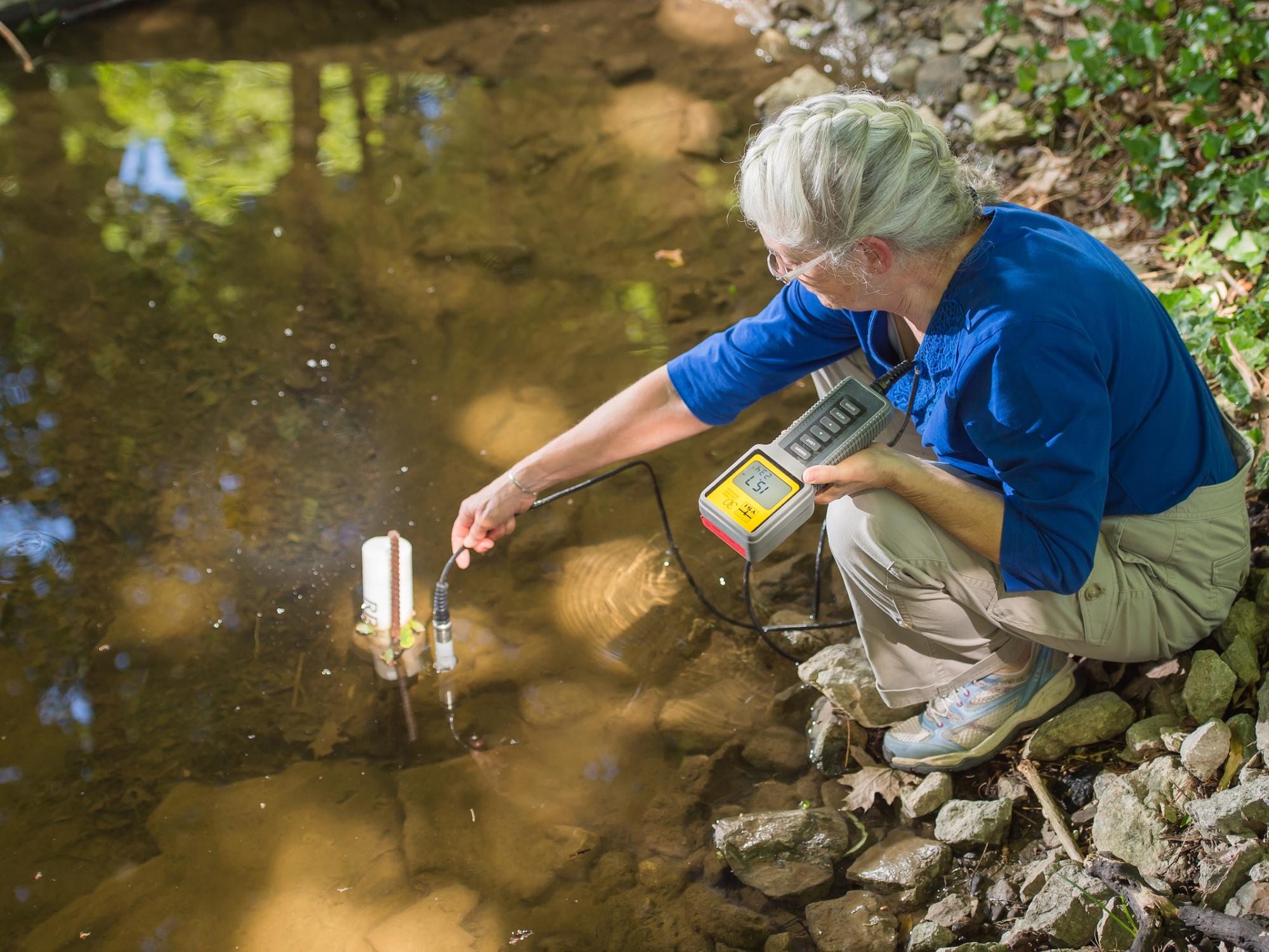 Silver takes a reading from Glenhill Stream