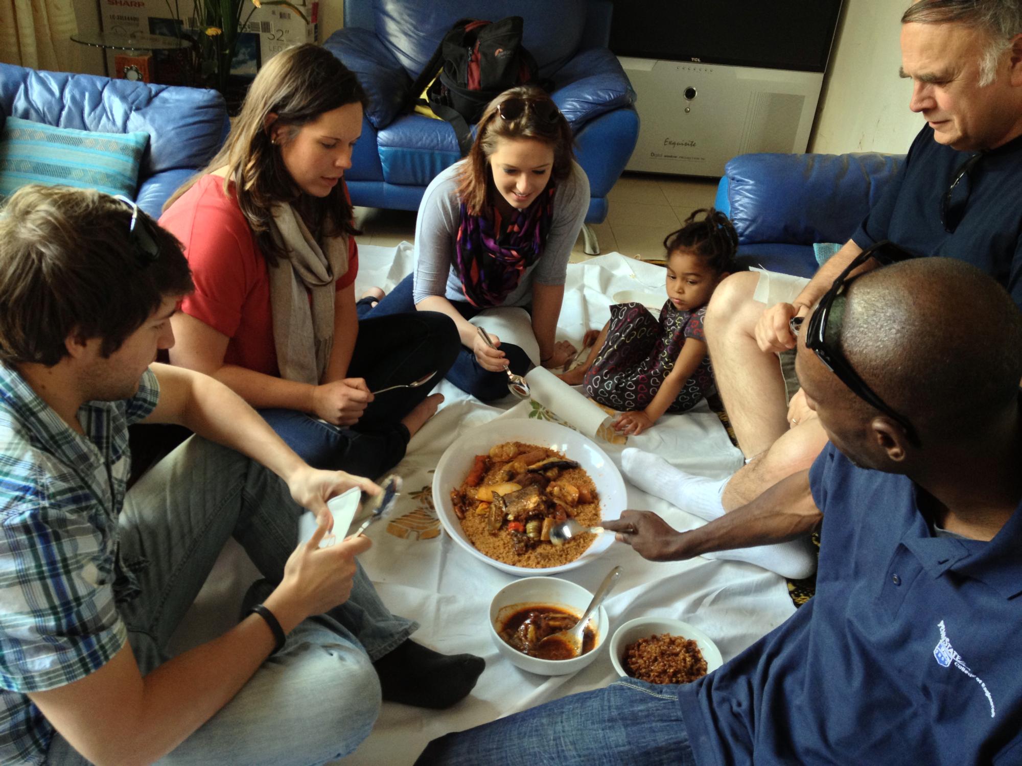 Students eat traditional Senegalese meal